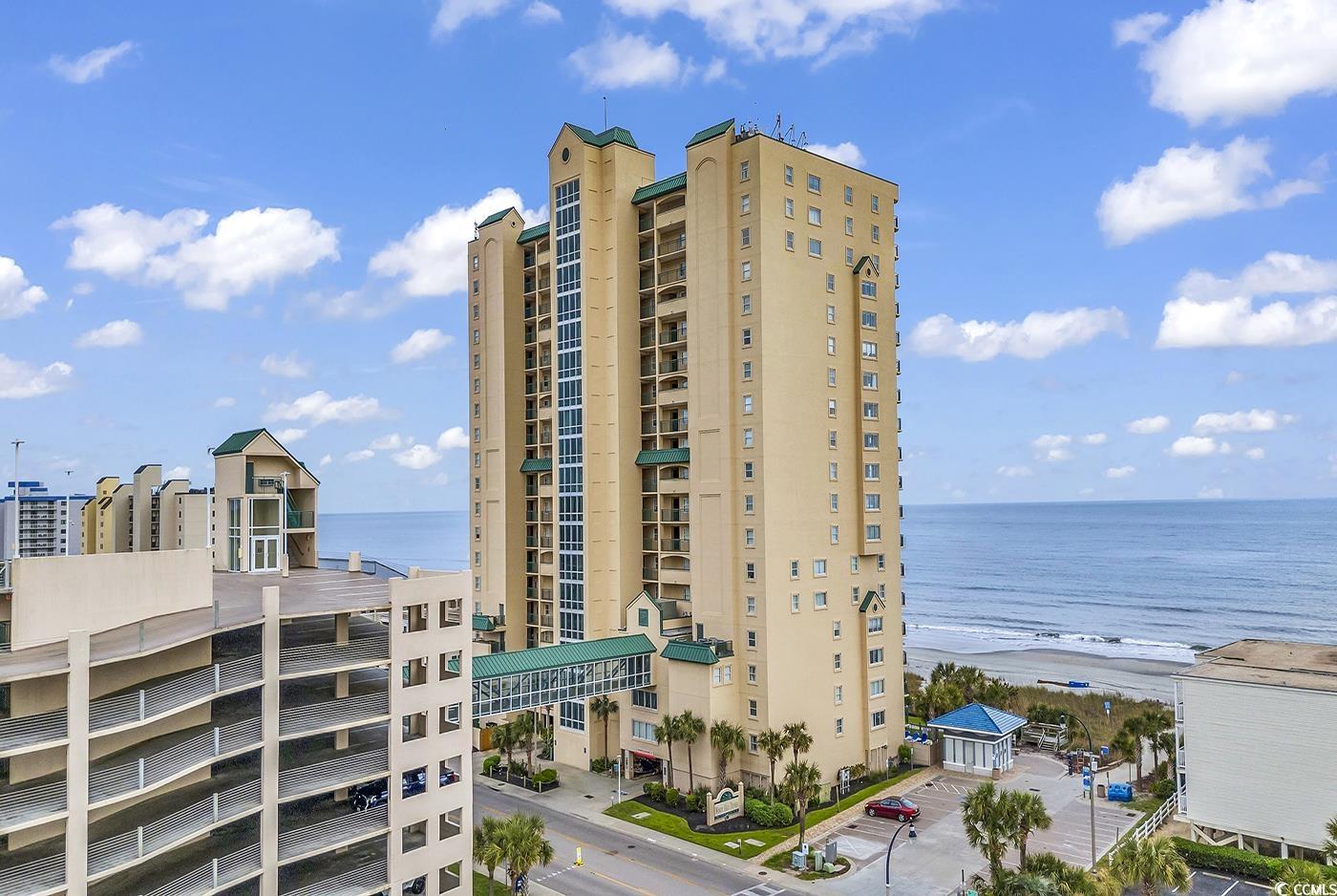 experience coastal luxury at its finest with this exquisite 3 bedroom 2 bath direct oceanfront condo located in the sought after windy hill section of north myrtle beach in windy hill dunes.  boasting panoramic views of the sparkling atlantic ocean, this meticulously maintained unit offers the perfect blend of comfort, style and convenience. as you step inside you will be captivated by the breathtaking vistas of endless sea visible from both the living area and primary bedroom. enjoy morning sunrises and evening breezes from your large balcony as you relax with family and friends, or retreat to the primary bedroom for a private seaside escape. the condo features new paint and furniture creating a fresh and inviting ambiance. whip up culinary delights in the well appointed full kitchen with ample storage space. for your convenience, a washer and dryer are in the unit ensuring effortless beach living. outside indulge in resort-style  amenities, including an oceanfront saltwater pool, lazy river, kiddie pool, hot tub all which provide endless entertainment for all ages. host unforgettable cookouts in the oceanfront grilling area featuring green egg or stay active in the exercise room. for added convenience, the condo includes an 8 level parking garage connected by an enclosed climate controlled walkway, ensuring hassle free arrivals and departures. explore the vibrant surroundings with easy access to golf courses, dining establishments, fishing charters, boating excursions and world-class entertainment options. with its million dollar view and unbeatable location just steps away from the soft sands of  the grand strand and atlantic ocean, this oceanfront oasis presents a rare opportunity to  own a piece of paradise in one of the most coveted destinations on the east coast.