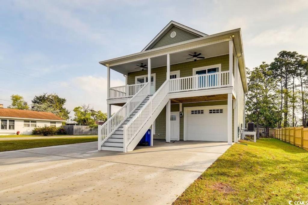 Come see this amazing beach house! Built in 2023, the home features 4 bedrooms and 3 bathrooms. The upstairs has a large open kitchen/dining/living area. Granite countertops, LVP flooring, primary bedroom has slider to front porch. The primary shower is cultured marble with multiple shower functions. A 5 hole putt-putt course was installed in the backyard! There are many games and fun outdoor activities with this house.  The pool was installed in 2023.