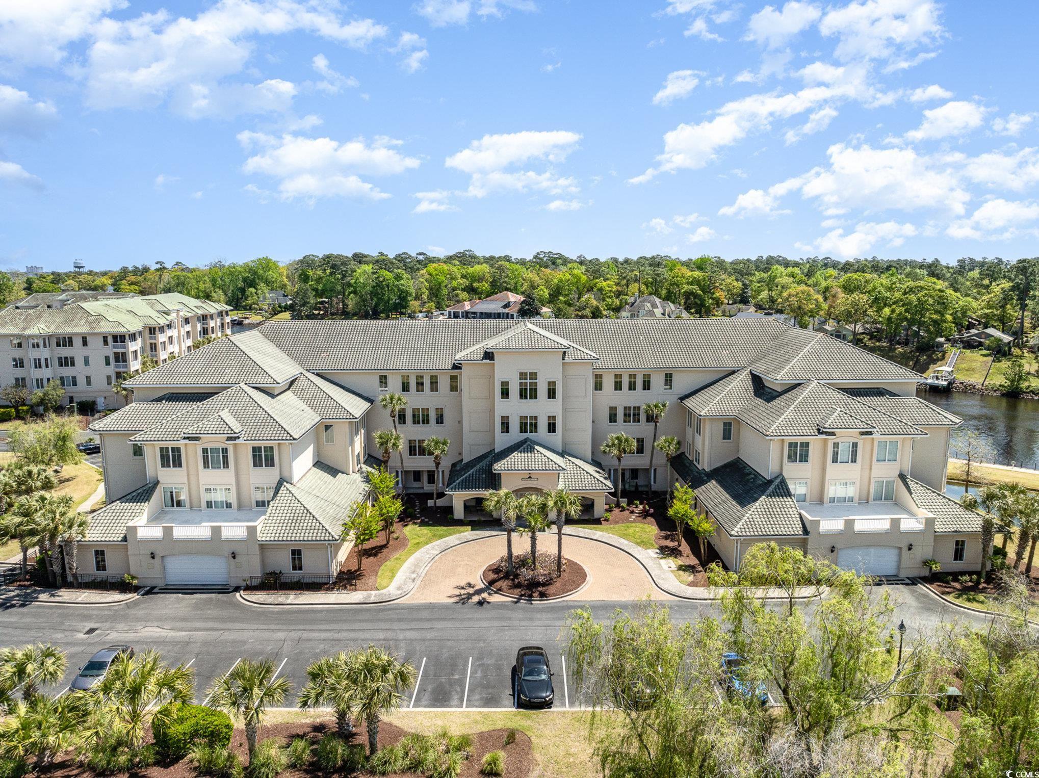 don't miss this beautifully kept 2 bedroom 2 bathroom condo with an amazing view overlooking the pool and the icw all located in the highly sought-after, gated community edgewater at barefoot resort. this unit is a dream, it's move in ready offering so much natural light, beautiful crown molding and trim, new paint throughout, newly installed carpet in the bedrooms and so much storage. the spacious kitchen features plenty of cabinet and counter space with stainless steel appliances, a pantry and a breakfast bar to do all your entertaining.  the master bedroom features a tray ceiling, two walk-in closets, and a private master bath with double sink vanities, a jetted bathtub, and a beautifully updated tile shower. the second bedroom also includes a walk-in closet and it's own access to the second bath! enjoy the view of the intercoastal waterway from your screened balcony, and from almost every room in the unit!  storage will never be an issue, you'll have ample storage within the condo, a separate storage room just steps from the front door and another storage unit in the private garage! edgewater is a beautifully maintained gated community that includes a waterway pool, clubhouse, fitness center and and so much more. barefoot resort includes access to the marina, a 15,000sf pool, an oceanfront cabana, and a shuttle service in season. owners may also take advantage of the golf memberships, social memberships, and all the perks barefoot owners have access to. whether you're looking for an investment opportunity, a second home near the beach, or your forever home, you won't want to miss this beauty or the view!!