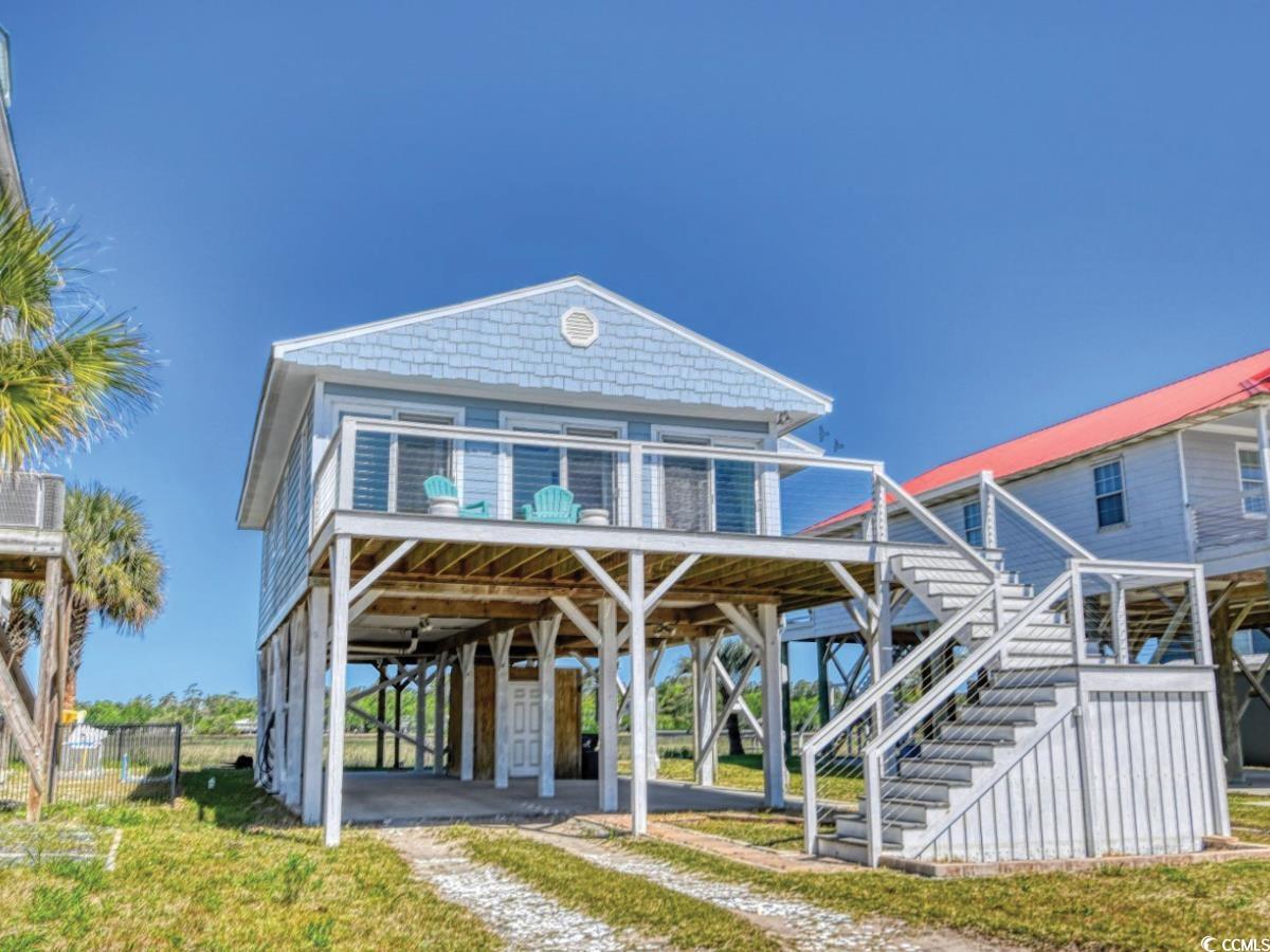 welcome to the beach wheel! this beautifully remodeled marsh-front home is only two blocks from the atlantic ocean in garden city beach, south carolina. the house offers spectacular sunsets from your front and back decks within walking distance to the garden city pier and atlantic ave with no hoa. this stand-alone, fully stilted 3br 2bth home is a rare opportunity to own waterfront property with low insurance and a beautiful view.  modern amenities include a tankless/electric water heater for endless hot water on demand, large porches, walk-in showers, and a completely branded home with a rich rental history.  whether your looking for a great short term rental property or just a wonderful vacation home this is it!