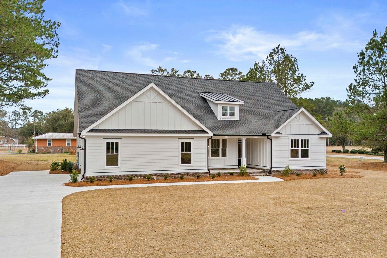 offering seller credits ! this custom 3-bedroom, 2-bathroom new construction home on 1 acre is now move in ready!! this home features a welcoming open floor concept, luxury vinyl plank, quartz surfaces throughout, and an oversized covered porch on front and rear. the master bedroom features a tray ceiling detail and a custom tile shower in the master bath. the kitchen is home to stainless steel appliances, electric stove, and a custom island. hardee board exterior and brick squirt and metal accents with expansive drive way this home shows that extra detail. great yard space and nestled away in small simple community with very little hoa. just 5 mins from town but the peaceful low country living may just be what your looking for !