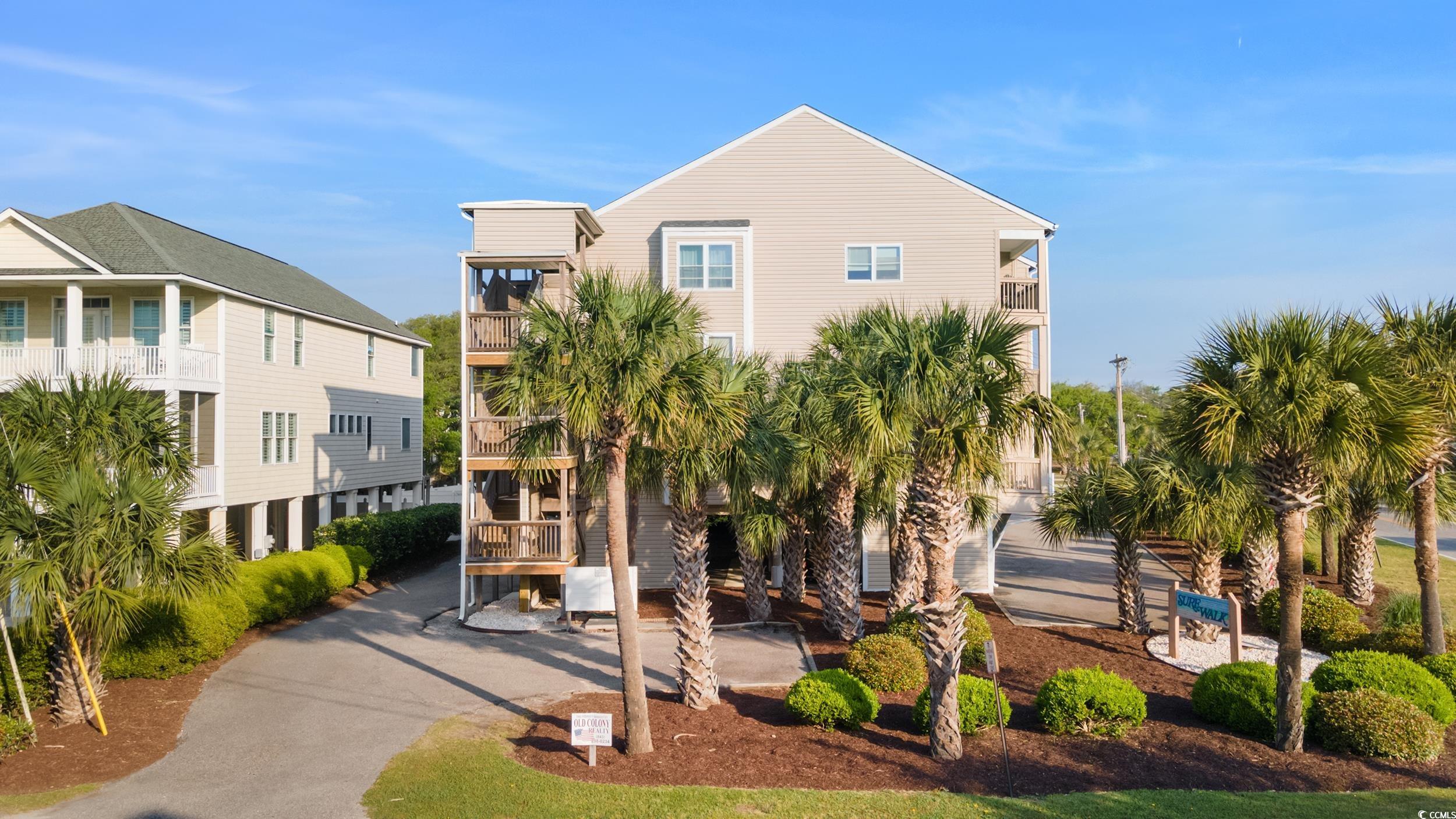 you will love this turnkey 2 bedroom, 2 bathroom condo just one block from the ocean! step inside to find a modern interior with many updates, including a new kitchen and new bathroom vanities, both updated in 2023. additional updates include: newer appliances (2020-2023), new windows (2024), hvac (2020), roof (2022), hot water heater (2018).  this corner, lockout-style unit offers ocean views, a spacious living room, dining room, and kitchen area and provides the ability to generate rental income. the condo has a lockout feature, allowing for flexibility in renting out one side while still enjoying privacy in the other. access the second floor via stairs or elevator. laundry room is located on the third floor. steps from the beach and convenient to all surfside beach has to offer!