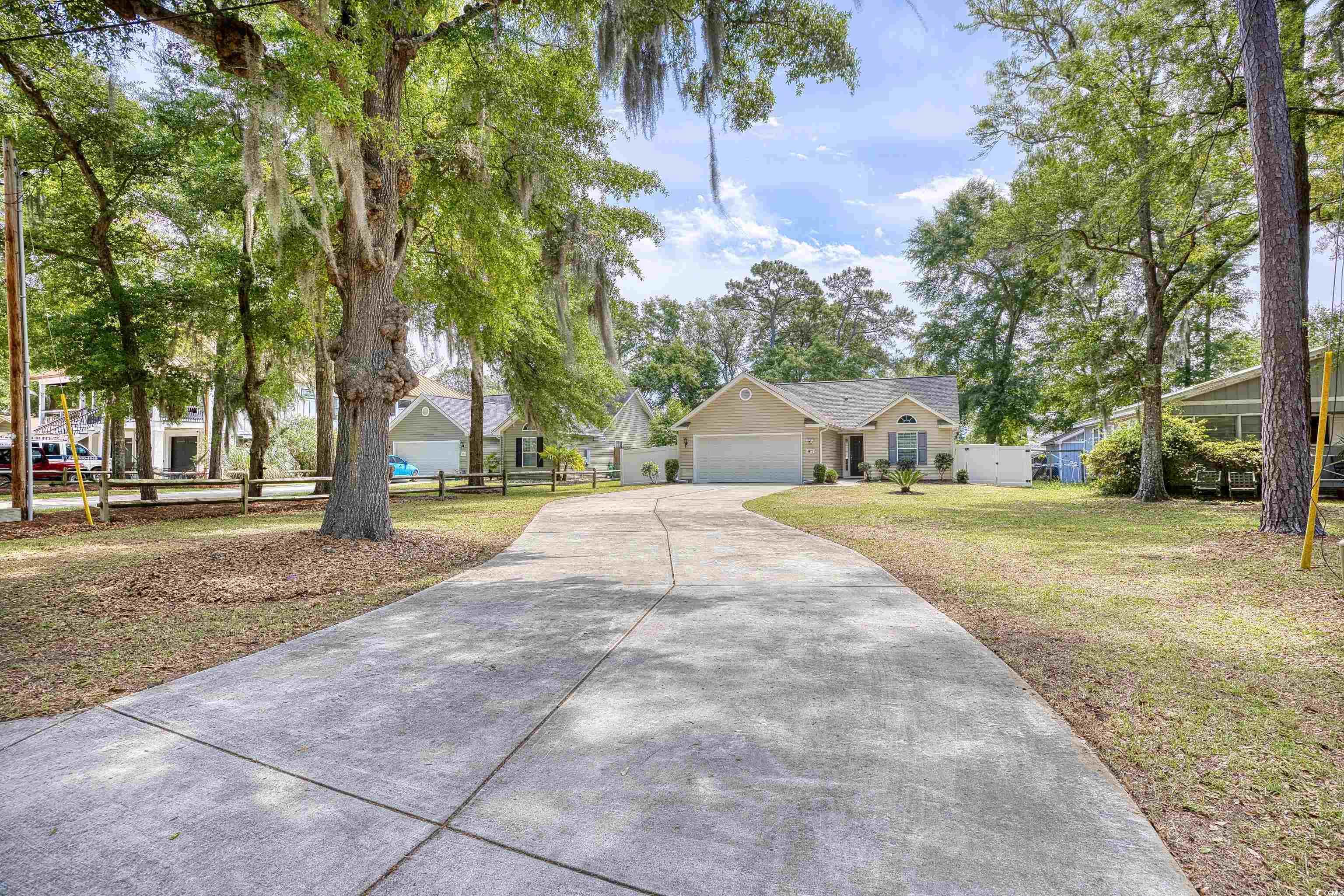 discover the epitome of coastal living without the constraints of an hoa in murrells inlet. this alluring ranch-style home, a recent construction from 2016, offers an idyllic blend of comfort and convenience with its one-story design featuring three well-appointed bedrooms and two full bathrooms.  step through the front door and be welcomed by a sunlit open floor plan with soaring vaulted ceilings that enhance the sense of spaciousness. vinyl flooring flows seamlessly throughout the residence, offering both beauty and durability. the heart of this home is undoubtedly the living area, which effortlessly transitions into the dining space and well-equipped kitchen, where all appliances stay with the home—including the washer and dryer.  the split-bedroom layout ensures privacy, with the primary suite boasting a generous walk-in closet and an en suite bathroom. meanwhile, the additional bedrooms are equally inviting, each with ample closet space, and one featuring a convenient pet door leading out to the fenced backyard, a haven for your furry friends.  outside, a cozy patio beckons for outdoor relaxation or dining, and the detached shed stands ready to store all your gardening tools. with a two-car garage offering additional storage and attic access, this home is as practical as it is charming.  tailored to those with an adventurous spirit and entrepreneurial mindset, this property welcomes your boats, rvs, and work trucks, and embraces the potential for short-term rentals. just a stone's throw from the seafood capital's vibrant marsh walk, this home affords you proximity to excellent fishing, boat launches, scenic bike paths, and a lively nightlife scene. don't let this gem slip away—your coastal lifestyle awaits!