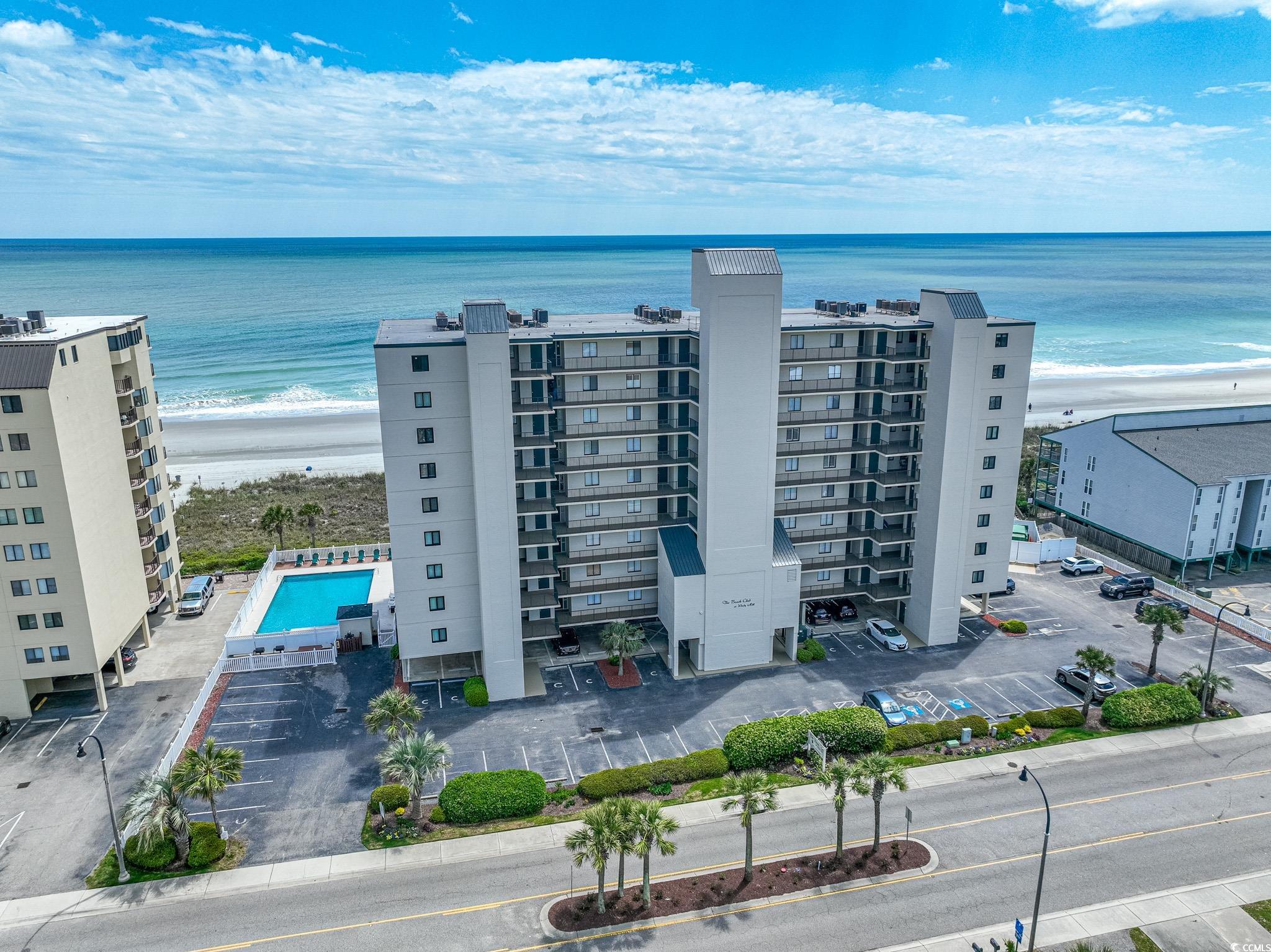 magnificent views of the beach from this oceanfront, fifth floor end unit. fully furnished four bedrooms, three baths, in beach club in the highly sought after windy hill section of north myrtle beach. enjoy breathtaking sunrises and sunsets from cherry grove to myrtle beach with the 180-degree panoramic views from the balcony. enter the unit through a sizable foyer with sitting area and lockable managers closet. you will immediately take note of the professsionally decorated unit with all furniture conveying.  tile and lvp flooring throughout. the kitchen boasts soft close white upper cabinets, pull out drawers for lowers, slate matte appliances, granite counters and backsplash, undercabinet lighting, a pantry, and a grand breakfast bar. spacious living room dining room combination with ceiling fan, chandelier, and large picture windows with views of the beach and a fold out sofa- this unit can comfortably sleep 10. the oceanfront primary bedroom has a ceiling fan, balcony access, walk-in closet, and a private bath with double vanity, whirlpool tub, and a stand-up shower. bedroom number two has a ceiling fan and its own private bath with vanity and a shower tub combination. bedrooms three and four have ceilings fans and share a "jack & jill" style bathroom that also has access from the hallway. other features include plantation style shutters, 60-gallon hot water heater with boosters, and laundry room with washer and dryer and shelving. beach club just had a million dollar exterior waterproofing and reskinning with overflow parking across the street and offers coded access to the elevator, private walkway to the beach, outdoor community pool, and much more. current owners have never rented the unit- it will make a fantastic primary , vacation home, or investment unit and beach club is located near shopping, dining, entertainment, hospitals, and the airport. square footage is approximate and not guaranteed. buyer responsible for verification.