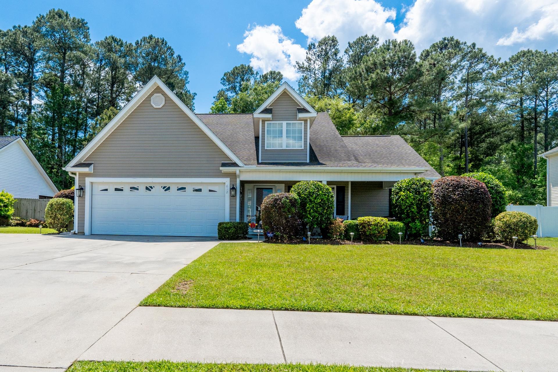 ***open house sat may 4th 1-3 & sun may 5th 12-3 pm*** introducing the newest listing in woodlyn meadows at 612 twinflower st. in little river, sc! this spacious home boasts 5 bedrooms, 3 full bathrooms, a big bonus room, and scenic water views from your low-country front porch. step into the cozy living room with high ceilings, lots of sunlight, beautiful hardwood floors, and more views of the lake. the updated kitchen is a chef's delight with a stylish new backsplash, two-toned cabinets, granite countertops, and a breakfast bar. on the first floor, you'll find 3 bedrooms including the primary bedroom with a large walk-in closet and ensuite bathroom featuring a double vanity, garden tub, and walk-in shower. upstairs, there are 2 more bedrooms, a bathroom, and a sizable bonus room. enjoy outdoor living on the screened porch or the patio, perfect for gatherings. the yard is landscaped and equipped with a sprinkler system. plus, there's plenty of storage in the walk-in attic and the oversized 2-car garage. with a new roof (2017) and a convenient location just a few miles from north myrtle beach, this home is a must-see! contact your realtor today to schedule a showing!