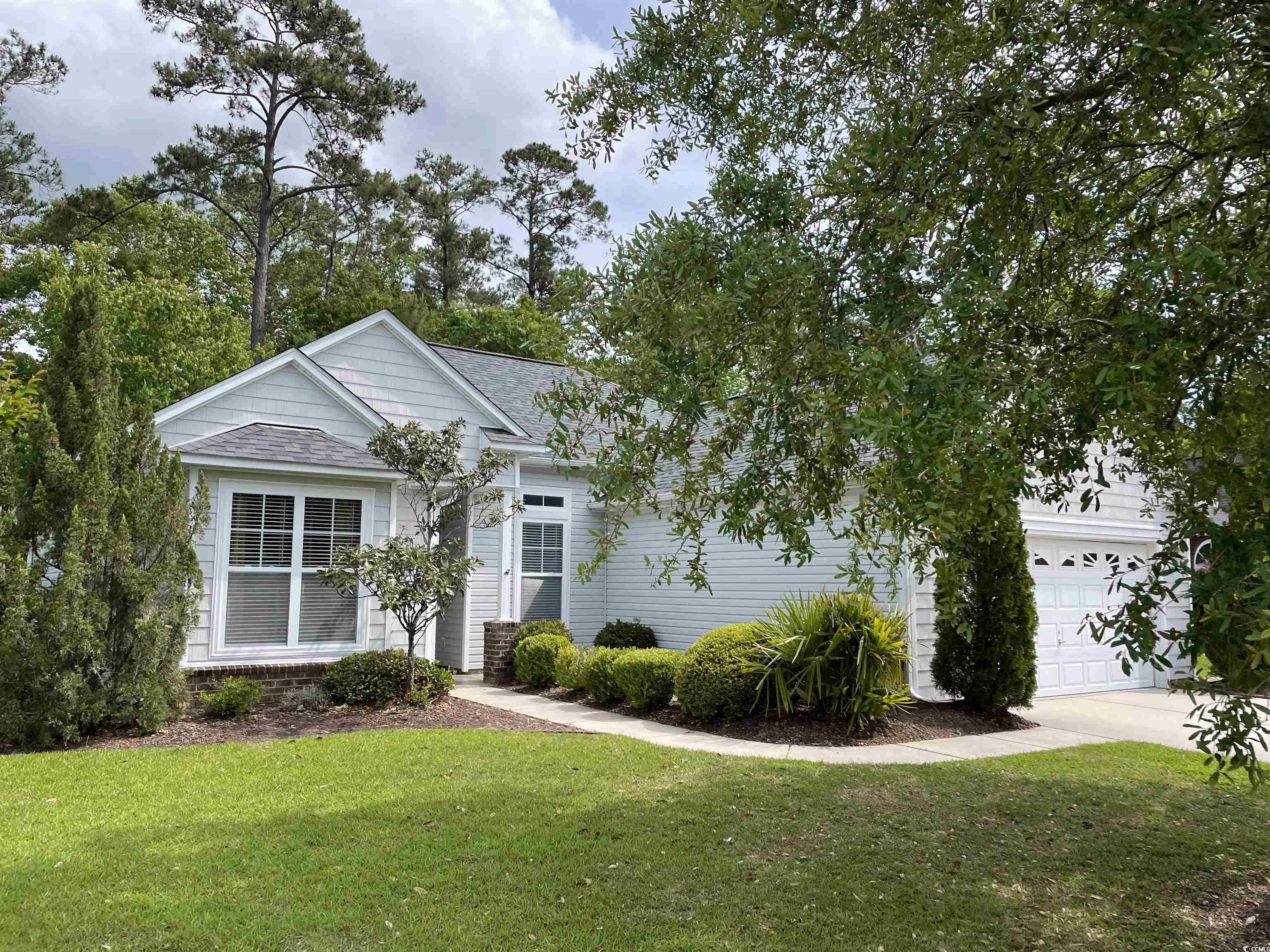** brand new roof added 3/20/24! ** located in the prestigious linksbrook at prince creek community in murrells inlet, this lovely 3 bedroom, 2 bath home is perfectly situated on a wooded natural preserve that borders the backyard offering peaceful solitude. the popular barrington model provides one-level living with a well-designed open floor plan that also offers privacy with the split bedroom design. the home showcases beautiful wood laminate flooring in the main living space with carpet in the bedrooms. the ceilings are tall and smooth throughout the home and combined with the vaulted ceilings that are featured in the kitchen, family room and the carolina room, they increase the open feel. the large kitchen boasts of cherry wood cabinetry, a pantry and a spacious breakfast nook. the carolina room is enriched with a steady flow of natural sunlight through the abundance of windows that enhance this room and the adjacent family room. the primary bedroom has a generously sized walk-in closet and a double trey ceiling and a decorative ceiling fan. the ensuite bath offers a vanity, soaking tub and separate walk-in shower. the two guest bedrooms have 9’ ceilings, ceiling fans and spacious closets. the guest bath has a tub/shower combination with easy access to the hallway linen closet. the utility room offers a full-size washer and dryer that convey with the purchase. the two-car attached garage provides appreciated convenience plus additional storage provided with pull-down steps to the generous space located above. the linksbrook community amenities include a private club house, zero-entry pool, fitness center, tennis courts, picnic area & playground. the prince creek community is home to the tpc players club and several other renowned golf courses, the popular marsh walk with an abundance of incredible restaurants, unique shops and a large selection of water/leisure activities including boating/fishing in both fresh and saltwater ~ as well as miles of gorgeous ocean beach to explore and enjoy! the information herein is furnished to the best of the listing agent's knowledge but it is subject to verification by the purchaser and their agent. listing agent takes no responsibility for the exactitude of information nor the condition of the property.