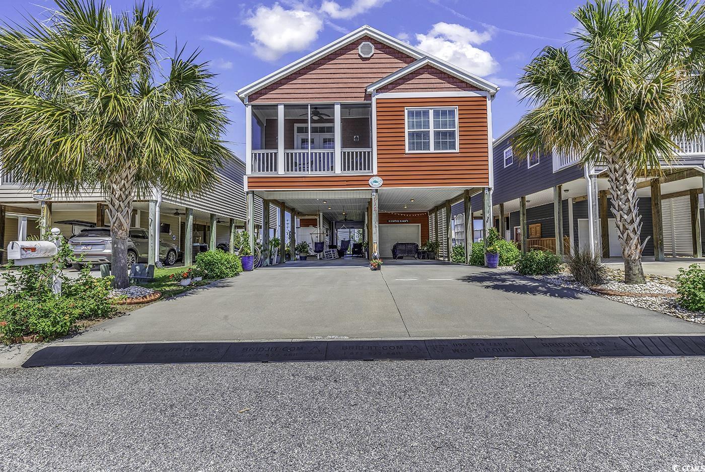 welcome to the epitome of luxury living at 719 ashland ave, north myrtle beach sc. a haven for the discerning buyer, this home offers a seamless blend of comfort, style, and sophistication. not to mention, its less than 5 minutes to the ocean! upon entering, you'll be drawn to the open living spaces, accentuated by the cathedral ceiling in the family room/dining area, and the warm ambiance of luxury vinyl plank floors. the large, gourmet kitchen is a chef's dream with its abundance of cabinets, smooth top stove, stainless steel appliances, and exquisite granite countertops. further updates include designer glass tile backsplashes and under cabinet lighting! this 3-bedroom, 3 and a half-bathroom property is thoughtfully designed for both relaxation and entertainment. each of the three bedrooms has its own private bath and the heated and cooled garage features a half bath! enjoy a tranquil afternoon on the roomy front porch, or entertain guests in the under-house area completed with a diamond bright custom floor coating. this area is perfect for enjoying breezes from the nearby ocean! a standout feature is your own elevator, making moving between floors or carrying groceries a breeze. the oversized garage offers ample storage and could easily transform into a workshop, plus it features a half bath and new heating and cooling unit!   one of the largest expenses for a homeowner is the roof, no worries here! this amazing home has a premium quality metal roof, to enhance the durability, you have a second membrane under the metal…. just think…. it’s like having two roofs on your beach home!   the second most costly expenses for a homeowner is the heating and cooling unit for the home! no worries here, a premium unit was just installed!  you're just minutes away from the ocean drive section of north myrtle beach, accessible by golf cart, and within close proximity to the north myrtle beach aquatic & fitness center. this home is more than a place to live, rent or make a second home… it's a lifestyle. your luxury beach style retreat awaits!