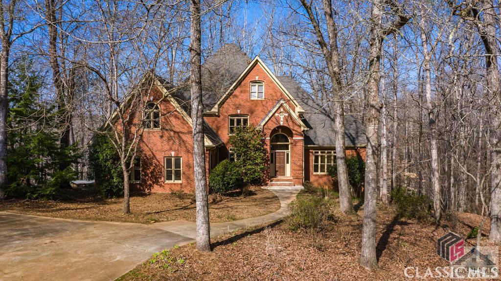 ***OWNER FINANCING AVAILABLE WITH ACCEPTABLE CONTRACT***  --->A rare opportunity in sought-after Oconee County, centrally located between Athens, Madison, & I-20 business epicenter Stanton Springs, escape to this 6,000+ SqFt, 4-Bed (2 Master Suites)/5-  Bath versatile English Country Estate of 9+ serene acres with Apalachee River frontage!  --->Enjoy this slice of paradise's benefits of elegant country living; be connected with HIGH-SPEED INTERNET available for entertainment, convenient home offices & remote work in this spacious home.  --->This unique Property boasts an additional 48'x70' 2-story building with versatile multi-purpose concrete-floored Garage/Barn/Workshop enclosed with six overhead doors. Bays area can accommodate multiple vehicles, equipment, trailers! Flex-use main level also includes versatile tack or stall, grooming area with pasture access, Office/Sportsman's Den, & large 1/2-bath, PLUS exterior-stairway to customizable 15'x70' floored/lighted upper-level w/deck!   --->Striking curb appeal, grand estate gates & tall brick pillars resonate stateliness, elegance, function, & privacy, along with ornamental fencing. Long scenic driveway passes beautifully developed fenced pasture, hardwoods, separate 2-story multi-use garage/barn, to arrive at grand home positioned for views & greater privacy. Landscape includes distinctive flagstone walkways, steps, extended patio.  --->Captivating, picturesque panoramic views with sight & sound of the APALACHEE RIVER rushing water just beyond wooded lowlands, springs, & stone outcroppings, from the expansive deck or terrace patio! Riverside living areas have windows, French/glass doors for spectacular views of the scenic River & well-wooded acreage. Whether indoors or out, relax & entertain friends, family, guests & business associates, including enjoying the courtyard stone fireplace ambiance.    --->Home's Main level features grand foyer with elegant brass 16-light chandelier, inviting open Great Room with see-through double-side gorgeous stone fireplace, un-dining/lounge, expanded Kitchen, 1/2-bath, Master Suite, laundry room w/utility sink.  --->Chef's gourmet 576SqFt kitchen has superb upgrades including a 7-burner LaCanche French stove with 2 ovens (dual fuel) & warming cabinet & Broan Nutone hood, 2 large farmhouse sinks, 2 dishwashers, granite countertops, expansive work island, incredible cabinetry, spacious eating area, walk-in pantry, mini-split AC/heat, & span of sliding doors to courtyard's fireplace!  Furnished with antique bakers stand & large heart-pine table for meals at holidays or anytime!   --->Main level Master Bedroom Suite has view, private balcony, ensuite bath (standalone bidet, dual sinks, soaking tub, walk-in shower, lots cabinets), closet, & sitting/study area.  --->Upper level includes 2nd Master Suite, plus 2 large bedrooms, 1 ensuite bath, plus 1 ensuite-styled bath adjoining 1 split-entry full hall bath, hall closet, & open stairway to huge walk-in attic. Attic is spacious, windowed, floored, has abundant storage capacity & other purposes designable!  --->Upper-level 2nd Master Suite, with alcove to exterior stairway to courtyard, extends from front to back of home, has ensuite bath, PLUS huge bonus area (entertain, play, store), PLUS a study with view of woods & river!  --->Spacious open Terrace Level features multiple French doors to patio & river views, great room/rec areas, brick fireplace (for free-standing wood stove), mini-split AC/heat; sports a wet bar/kitchenette with open dining area, mini-split AC/heat, full bath, closets, 2 large storage/mechanical rooms.   --->CertainTeed Architectural Landmark Pro roof 11/2023. Hardwood floors, tile, carpet, finished concrete, luxury vinyl plank. Whole-house fan. Auxiliary propane heat. Transfer Switch Box for adding home generator! Septic Tanks   1 Home, 1 Garage/barn.  ***Listing Agent is Spouse of Seller/Owner. Seller is a licensed GA Real Estate Agent.