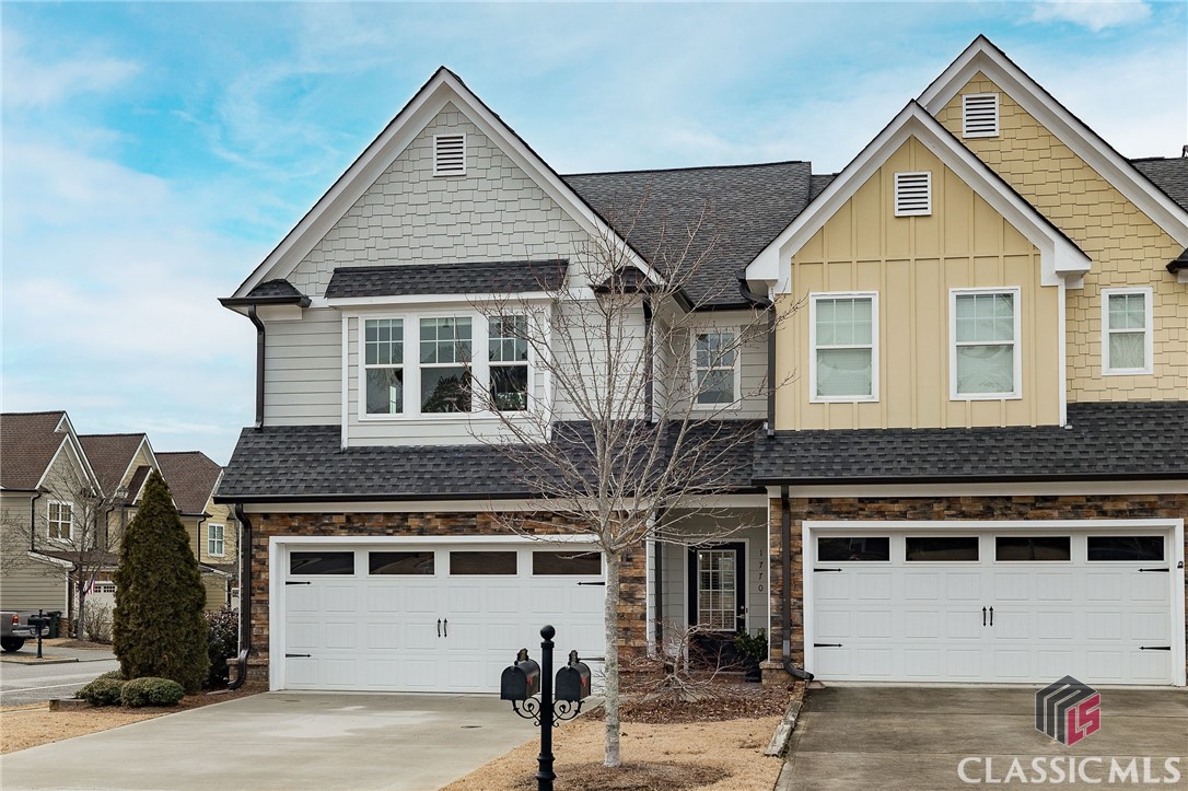 This North Oconee 4-bed, 2.5-bath townhome is a prime example of perfect location! Just 2 miles from Hwy 316 off Hwy 78, it's a quick 15 to 20 minutes to Athens, Monroe, Bethlehem, and Winder. Nestled in a gated community, enjoy a full array of amenities including a clubhouse, weight/exercise room, pool, playground, tennis, and pickleball courts. Outside your front door, find beautifully landscaped areas and sidewalks for strolls.

Inside, the floorplan is easy living. The bright entry level has a great room open to the kitchen and dining area, a powder room, and access to the two-car garage with storage. Upstairs, the owner's suite has an ensuite with a garden tub, separate shower, and double sink vanity. Three more bedrooms, a full bath, and a handy laundry complete the upper level. Well-maintained and move-in ready for you today!