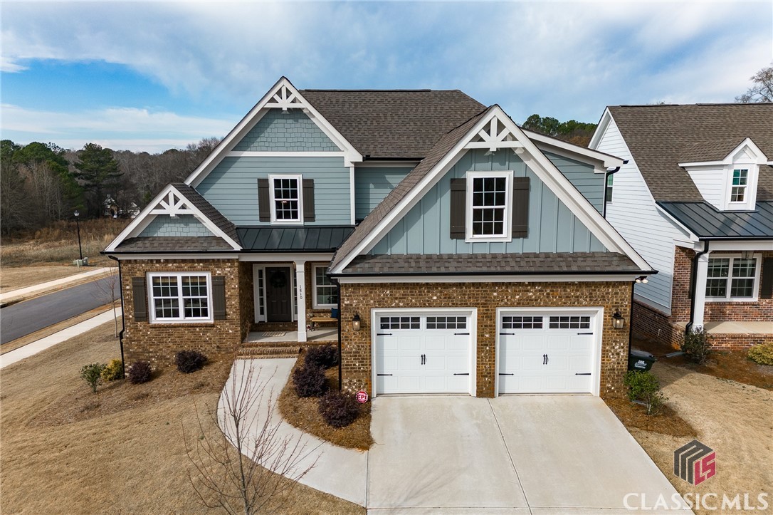 Location, location, location! Welcome home to 1810 Willow Creek Drive. Your new home awaits in sought after Oconee County with award winning schools. This Kensington 2 plan is located on a corner lot with a fenced in backyard and finished basement. This 5 bed, 3.5 bath home is complete with the master on main. The master bathroom features a custom tile shower and large walk-in closet. Upstairs there are three bedrooms and a full bath along with a linen closet. The finished basement has one bedroom, a full bath, and  three large living spaces that can be used for a living room, workout area, office space, etc. The kitchen has a large island with granite countertops. The home also features matte black hinges and door hardware, tile in the bathroom floors and laundry area, as well as LVP floors on the main level and basement! The are plenty of windows for natural light, a wood burning fireplace to cozy up to on cool nights, an extra parking pad on the side of the house for your guests, and a large wooden deck with stairs leading to the fenced in back yard - a great place to enjoy the sunset. Willow Creek has a community pool, tennis courts, and a clubhouse. Call or text to schedule a showing today!