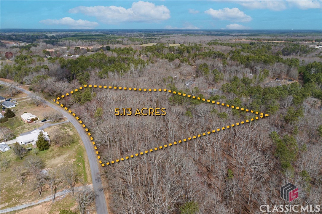 Come explore this wonderful 5-acre lot in Crawford, GA, just a quick 20-minute drive from Athens, GA. It's been recently spruced up to showcase the perfect spot to build your dream home. Surrounded by beautiful hardwood trees, this spacious lot offers plenty of seclusion and tranquility. Plus, it's zoned R-1 (will allow Single-family detached dwellings or individual  Class A  Manufactured Housing) with no HOA limitations. With city water access, more than 450 feet of paved road frontage, and a charming creek nearby, this property has it all.