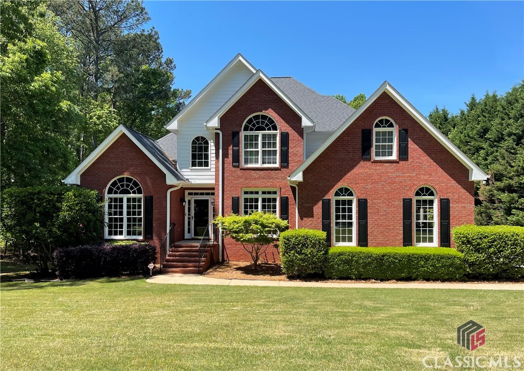 Oconee county living at its best! Located in the desirable North Oconee High School district, including the new Dove Creek Elementary & Middle Schools, or less than 5 minutes from the esteemed Prince Avenue Academy. As you enter the foyer you will be surrounded by the natural light cascading in from the family room windows, as well as the living room and dining room windows that flank you on your left and right.  Centrally located is the family room featuring hardwood floors, a lofty ceiling, french doors and a beautiful fireplace.  Opening to the family room is the well appointed kitchen featuring solid cherry cabinetry, new granite countertops and an island for entertaining, or an extra prep area.  The primary bedroom and en suite are also located on the main and offers a perfect place to unwind and sit a few minutes by the windows that overlook the landscaped back yard.  The en suite features a double sink vanities, separate shower & jetted tub. Additionally, there is a powder room and large laundry room on the main level. The upper level features three bedrooms and a full bathroom, plus a sitting/office/reading area.   Step outside through the french doors off the family room onto the recently replaced large deck to view the beautifully landscaped backyard.  It is fully fenced and the storage shed will remain with the property. The full basement has a working garden sink and is plumbed for a full bathroom.  The basement was recently fully waterproofed and provides a lifetime transferable guarantee.  This property offers a sought after Oconee county location, a great design and a lovely neighborhood.