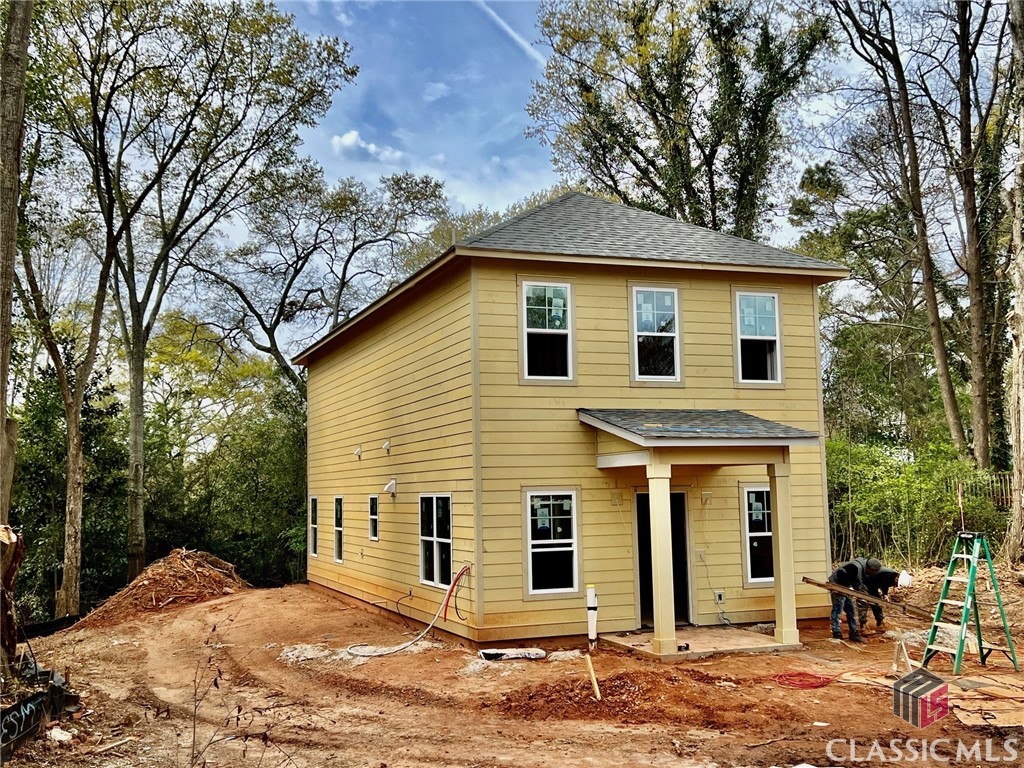 Under Contract before published. In-town New Construction by Award-Winning J W York Homes, this 2-story 4/3 home is scheduled for completion by late May, 2024. It sits on a .27 acre lot tucked behind a 3/2 historic cottage ( also available for sale ) at 326 Arch Street, accessed by a shared driveway easement, thus is somewhat privately tucked away off the street, and the associated traffic. The house plan features 3 bedrooms/2 baths upstairs, including a Master suite. on the main level, there's a 4th BR and 3rd full bath. Additionally, there's an open common living area that includes a stylish kitchen with island, pantry, quartz countertops/tile backsplash, stainless electric range, dishwasher, and microwave. The LR & DR are open to kitchen, and a hallway leads to a private back porch.