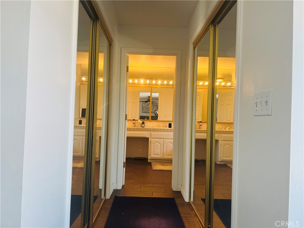 Master hallway with dual walk-in closets