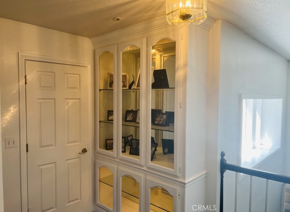 Built-in cabinetry in upstairs hall with lighting