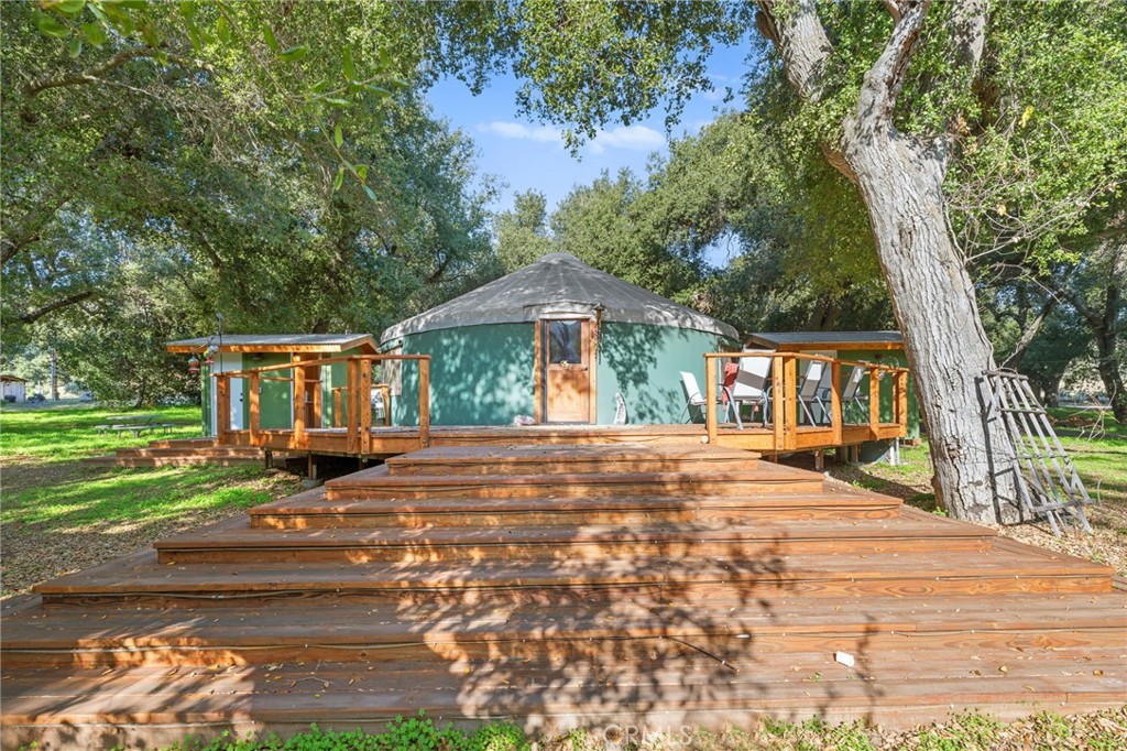 This 30-foot diameter, 700 square foot Yurt is heated, air-conditioned, beautiful and supported on a structurally stout wrapping redwood deck. Two bathrooms, storage unit and one of the best views of the Oak forest.