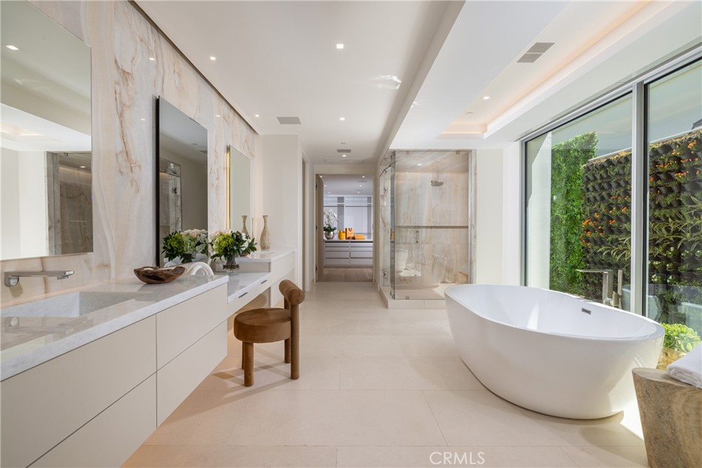 Main level Primary Bathroom with heated floors and green wall