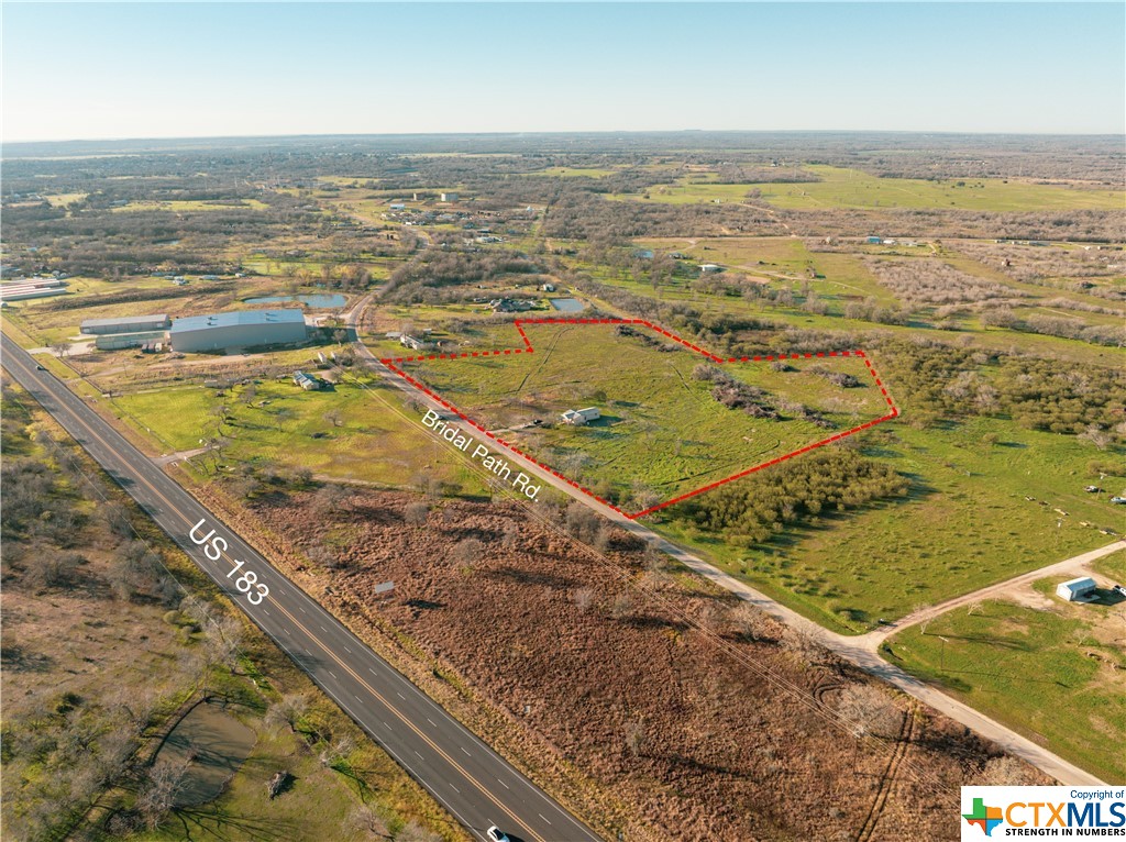 Commercial +/- 10 acres in Luling conveniently located just off US HWY 183. The current C-3 zoning allows for multiple uses including RV Park, Self Storage, Gas Station, and more. Engineered plans convey for an RV Park with 61 spaces (20'x60') and a 387 unit self storage site with 22 RV/Boat spaces. A 12'’ water line and 8'’ waste water line is directly across the street providing ample supply and easy access to utilities needed for any development. Additionally, an existing 1,000 square foot building is on the property that can be utilized as an office or home. Overall, this commercial property stands as a sound investment in the growing city of Luling!