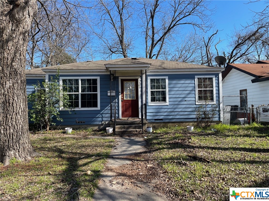 This home needs some TLC. Hardwood floors refinished could be beautiful. Large living room and dining added to the back, open to the kitchen, unusual floor plan. Separate bedrooms. Secondary bedrooms can have an office, play room between them. Endless ideas can make this a very cute home. Front living small and cozy.