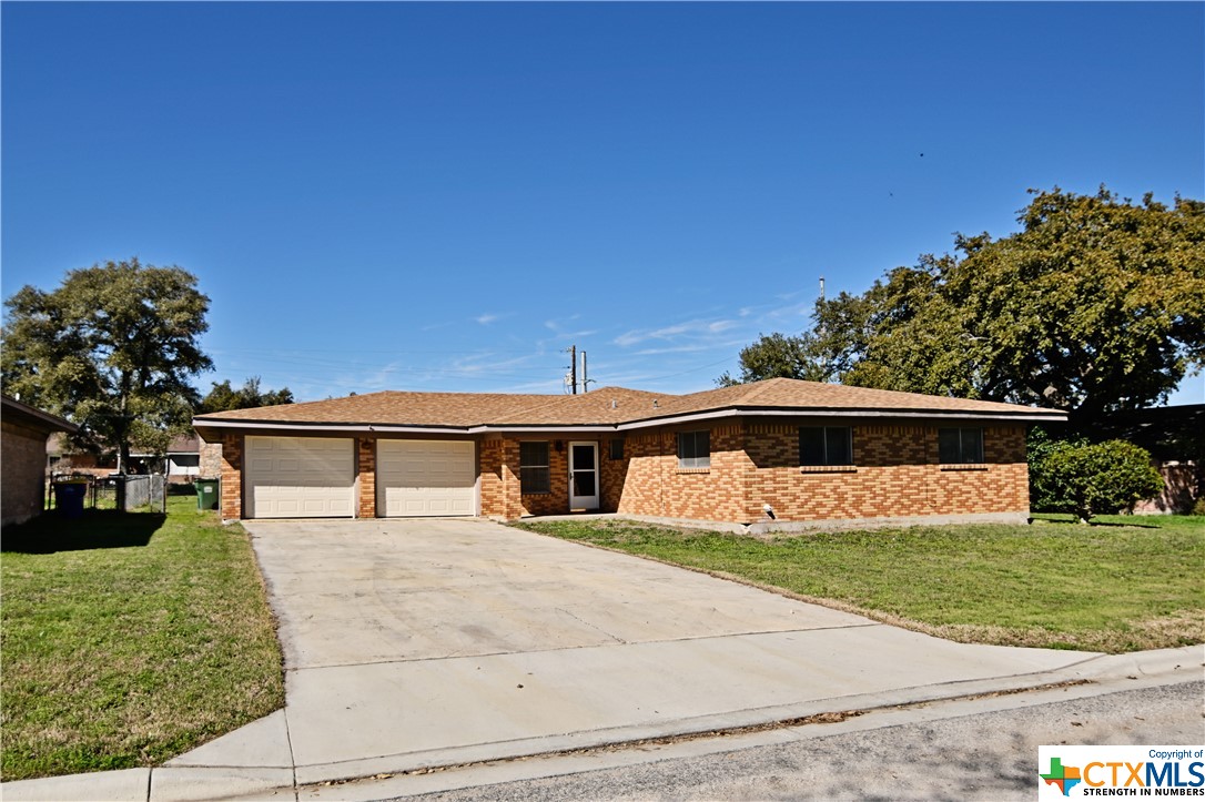 Welcome to 711 Ridgemont, centrally located in Gonzales, Texas. This inviting 3-bedroom, 2-bathroom home showcases a recently revitalized interior, Featuring updated flooring, fresh paint, upgraded countertops, and fully renovated bathrooms. Enter into the cozy living room, before transitioning into the expansive open-concept area encompassing the dining and kitchen spaces—a haven for effortless entertaining and everyday living. Through the sliding glass door, discover the expansive backyard, offering ample space for relaxation and outdoor activities. Noteworthy are the exterior updates completed in 2023, including a new roof and garage doors, ensuring both curb appeal and peace of mind.