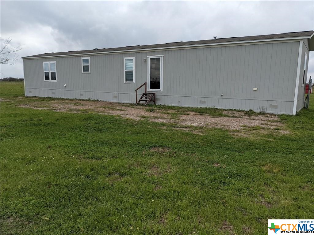 Newer manufactured home on just over 5 acres outside of city limits on a corner lot. Home offers open concept, neutral colors and no carpet. There is plenty of room to expand, build, grow a garden or raise livestock. Fully fenced in for horses and has a lean-to for shelter. Enjoy country living with a short drive to city conveniences when desired.