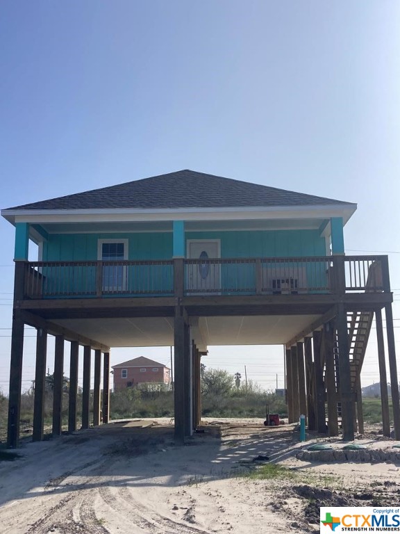 Check out this fabulous new construction 3/2 stilt home in the desirable Holiday Beach area!  This home has an open floor plan, a large upper deck with a water view, an upstairs laundry room, a large master closet, and plenty of space under the home for relaxing outdoors or parking. Plenty of room for boat parking under the home as well!  Many upgrades including laminate wood look floors, tile backsplash, & granite counters.  The Holiday Beach Subdivision has a community pool, pier, and boat ramps.  You will be within minutes of the Rockport Beach and local shops and restaurants.  This would make a wonderful getaway, investment property, or permanent home.  Short and long term rentals allowed.  Schedule a tour today!