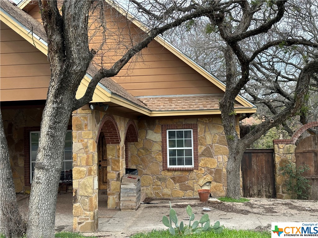 This is a project that needs to be taken over.  This is a wonderful beautiful rock home that can be made into more.  There loss is your gain.  The second floor had been started but is incomplete.  The back yard can be perfect for entertaining.