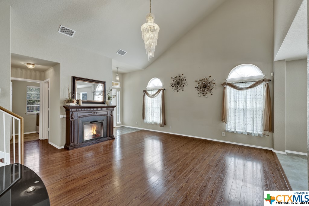 family room fireplace included. drapes and wall decorations included