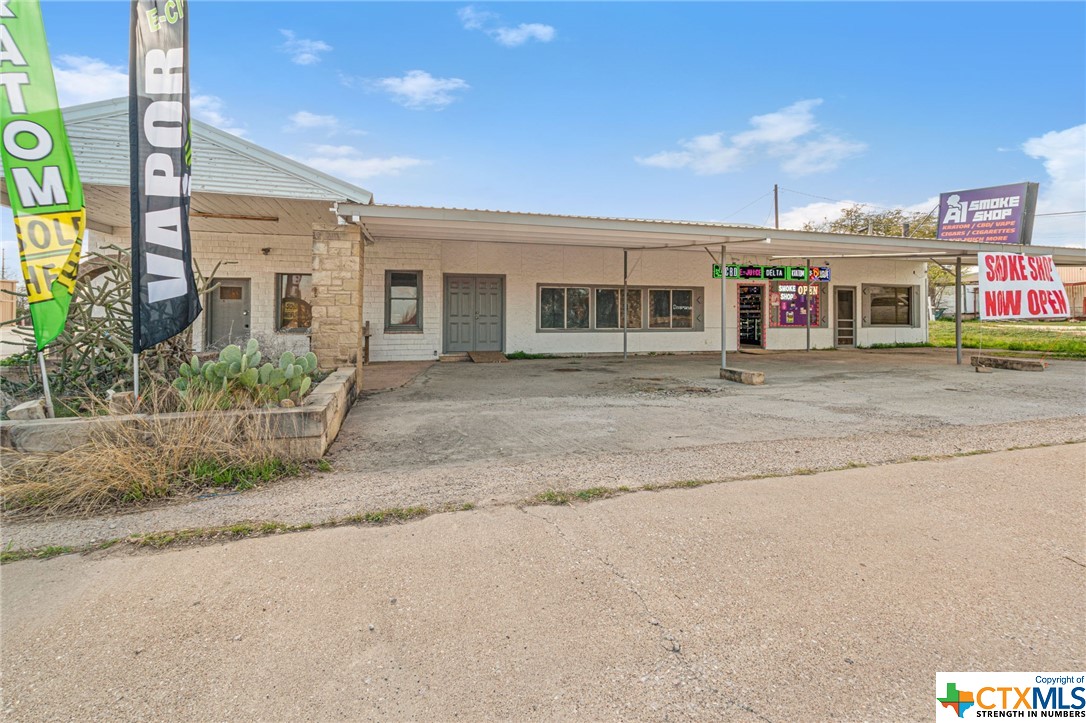 Located in Lometa, TX, this commercial property boasts an approximately 4800 square foot building, formerly utilized as a taxidermy business. Offering multiple office spaces, a kitchen area, three bathrooms, ample storage facilities, covered parking, and a convenient loading door, this property presents versatility for various business endeavors. Its prime location on a corner lot with frontage along US 183 further enhances its appeal, making it an ideal choice for office space or retail purposes.