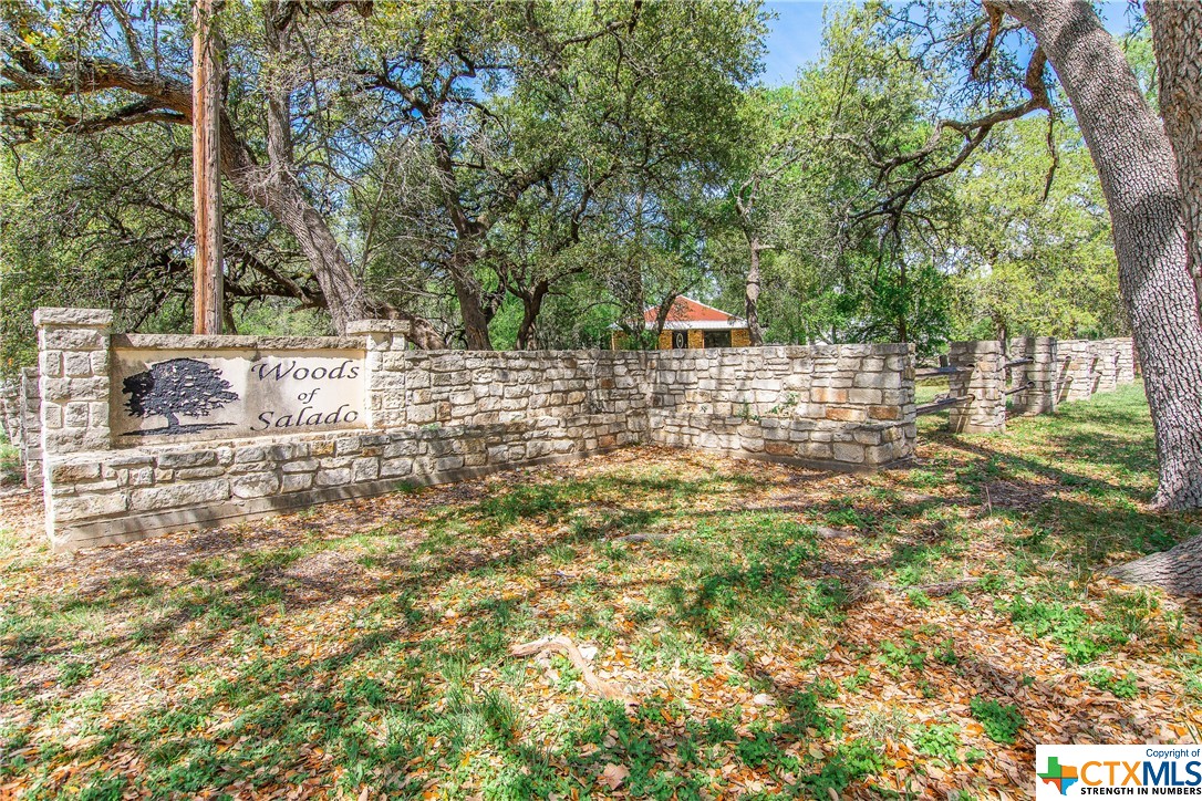 Your next endeavor awaits you at 10880 Hodge Canyon Dr in Salado. This property features a 1,140 sq ft 2 bed 1 bath multi-use building that sits in the middle of a mature tree lined corner lot, boasting a private drive and personal parking along Hodge Canyon Dr with its own secluded walkway to a covered front porch that greets you with two oversized windows. Fully renovated, this property will give you the space you need for an office front, private meetings and everything in between. New roof. New central heat and A/C. New paint, flooring and fixtures. This space features a full bath, along with shower and an additional capped line in the adjacent closet that can be used for an additional shower or bath. Outside you will be amazed with the usable space. Mature trees adorn this rectangular shaped lot that allows for easy in and out no matter what business you are into. The FM-2484 frontage space is lined with wood fencing and has WOODS OF SALADO adorned in stone greeting you as you enter the property. To top it all off, there is a new 3-bay shop with roll-up doors and an additional usable office space on a concrete slab. The opportunities are endless here in The Woods of Salado. Reach out today for more information.