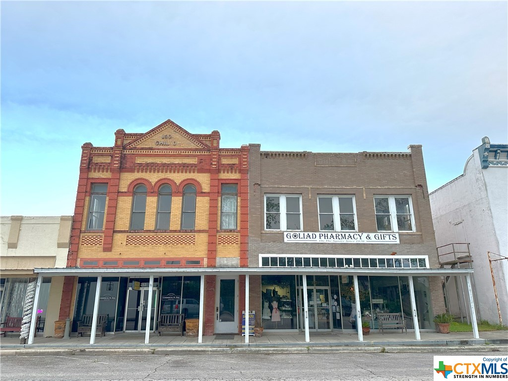 Here's your chance to own one of Goliad's most historic buildings downtown! The Chilton building, built in 1900, is home to the beautiful Commercial Street Bar and Grill. This property, which entails 4480 square feet of retail space on the first floor, also includes the Goliad Pharmacy which brings in rental income each month. There is 729 square feet of finished retail space, out of the 4480 square feet located on the second floor to be finished out to the owners liking. There is also a 330 square foot detached kitchen located behind the building by the outdoor entertainment area. Don't miss your chance to own this great retail space in downtown historic Goliad!