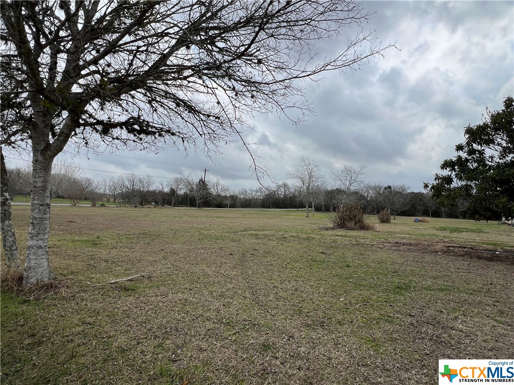 A 6.445-acre tract with city utilities and is ready for a new build, mobile or modular home. The property is zoned for residential and would need to be rezoned for commercial use. It is bordered by US 77A-N and Old Shiner Road.  Both open spaces and trees make this small tract of acreage perfect to enjoy easy access to the local stores, restaurants, and entertainment while still having the country feel The is also a seasonal creek at the back of the property.