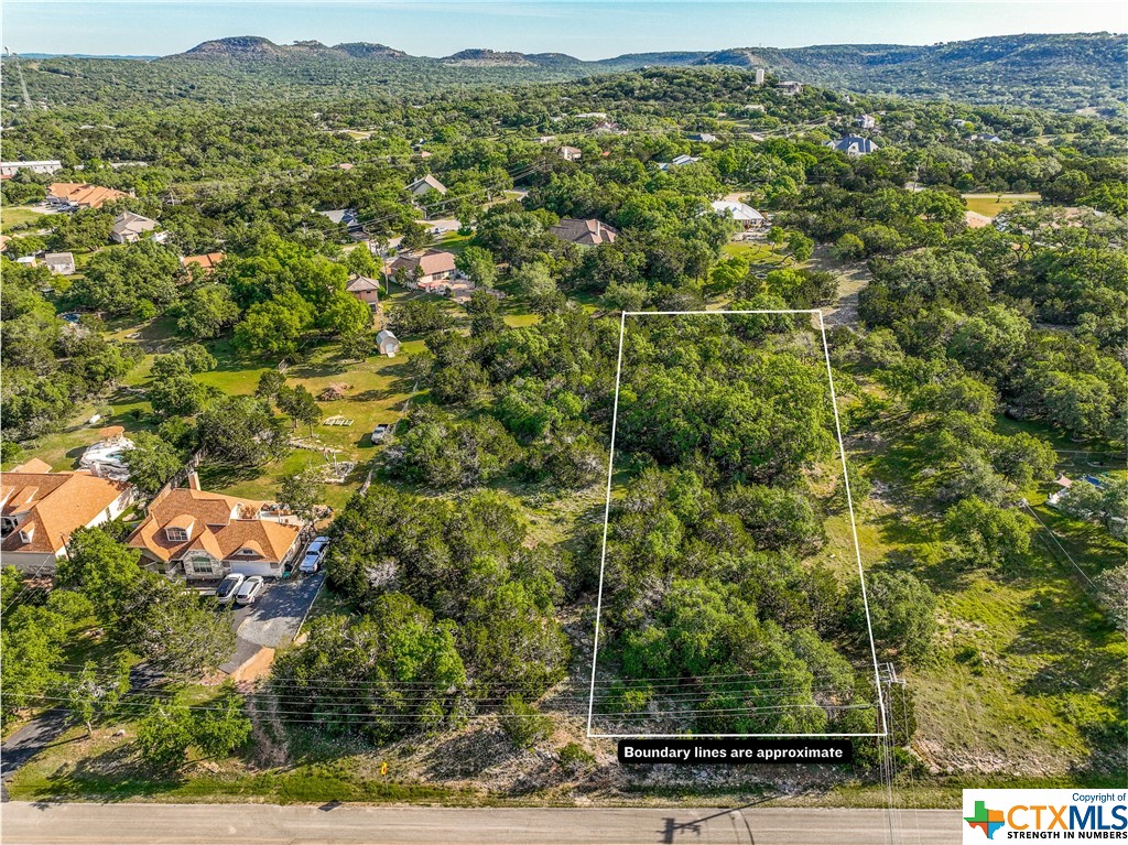 This property presents an exceptional opportunity with its flat lot and the option to acquire the adjacent lot, ensuring ample space for development or investment. Nestled in the sought-after Clear Water Estates neighborhood, just a brief five-minute drive from Canyon Lake, it promises a vibrant lakeside lifestyle with easy access to water activities, dining, and recreational options. Surrounded by mature trees and situated in an established neighborhood, it also boasts reasonable square footage build restrictions, ideal for crafting your dream home or investment project.