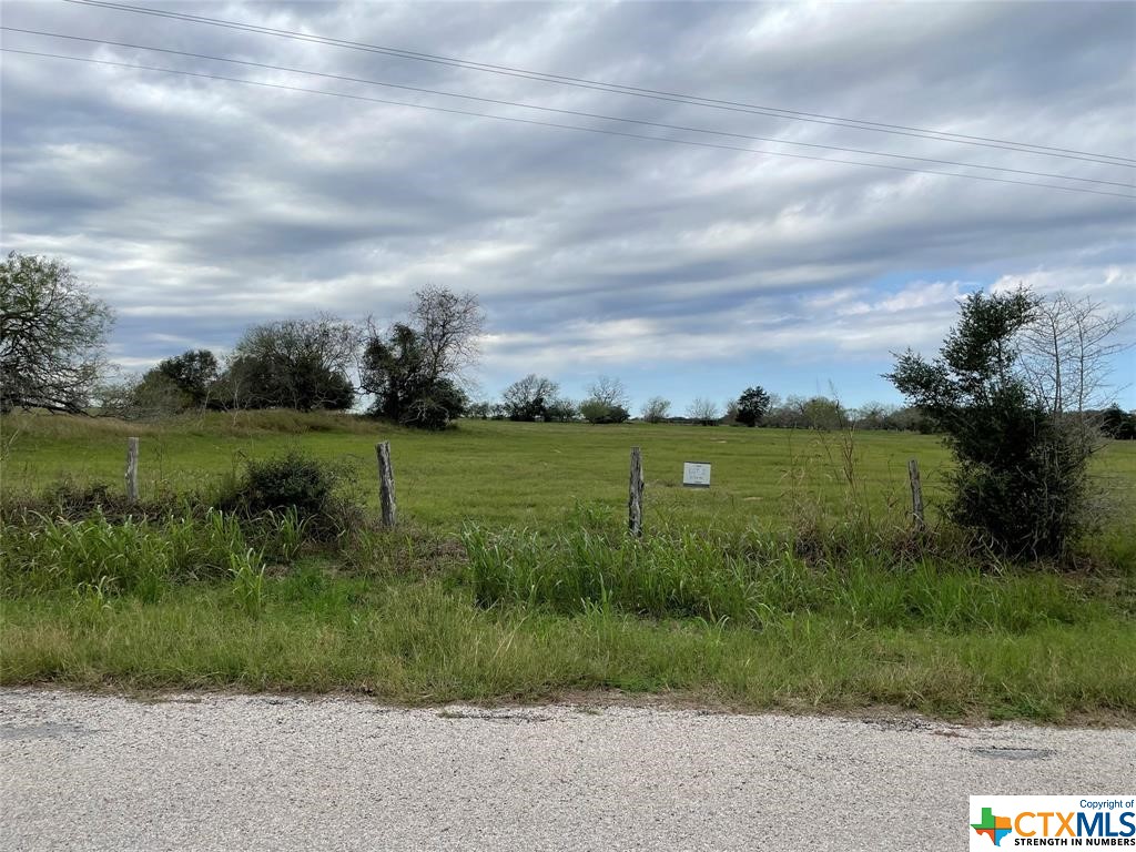 Beautiful UNRESTRICTED 5.126 Acre lot on CR 1 near FM 531 South of Hallettsville. NO FLOOD ZONE. Small town country living. Close to schools, shopping, diners, wineries and places of worship. Manufactured homes and barndominiums allowed. Horses/livestock allowed. 133' of frontage on paved County Road 1. One minute to Ezzell ISD School. 16 minutes to Hallettsville and Hallettsville ISD. 30 minutes to Victoria. 33 Minutes to Schulenburg. Lavaca County has approved the division of 5.126 acres out of a 39+/- acre tract. Google Map 12194 County Rd 1 in Hallettsville for closest address. Some map apps are incorrect.
