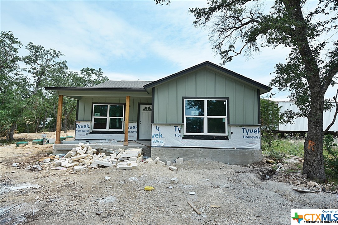 The Heron plan is back! Located on a great street to street lot with mature trees, this plan is open with vaulted ceiling, granite counters and stained concrete floors throughout!