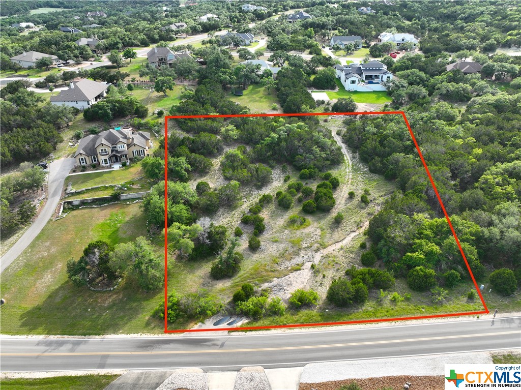 Almost 2 acres of Hill Country land priced to sell!! Leave the hustle and bustle of the city behind and drive out to Mountain Springs Ranch. Conveniently located just 34 minutes from San Antonio airport and less than 20 minutes from the cool, clear waters of Canyon Lake.  This lot has so many possibilities, partially cleared but still has plenty of mature trees for beauty and privacy. Nice square shape to the lot gives that extra width for distance between neighbors. Decent topography will make building your dream home easier and it has Hill Country views!! Only 2300 sq ft minimum building requirement. Neighborhood amenities include a great pool complex, playground, and walking trails for your community enjoyment. Don't hesitate, drive out and see this lot today!!