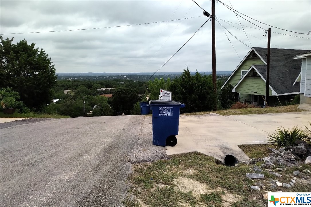 ENJOY PEEK-OF-THE-LAKE VIEWS AND BEAUTIFUL TEXAS HILL COUNTRY VIEWS FROM THIS HILLTOP LOT WITH MATURE TREES LOCATED IN THE SCENIC HEIGHTS SUBDIVISION ON THE SOUTH SIDE OF THE LAKE* ONLY 600 SF MINIMUM RESIDENCE REQUIRED* GUEST HOUSE OK* SUBDIVISION PARK FOR YOUR ENJOYMENT* MINUTES TO BOTH CANYON LAKE AND THE GUADALUPE RIVER*(ALSO FOR SALE - PURCHASE LOT 563 (259 VALLEY RIDGE) ADJOINING BELOW TOGETHER FOR $99,000 TOTAL SALES PRICE.)