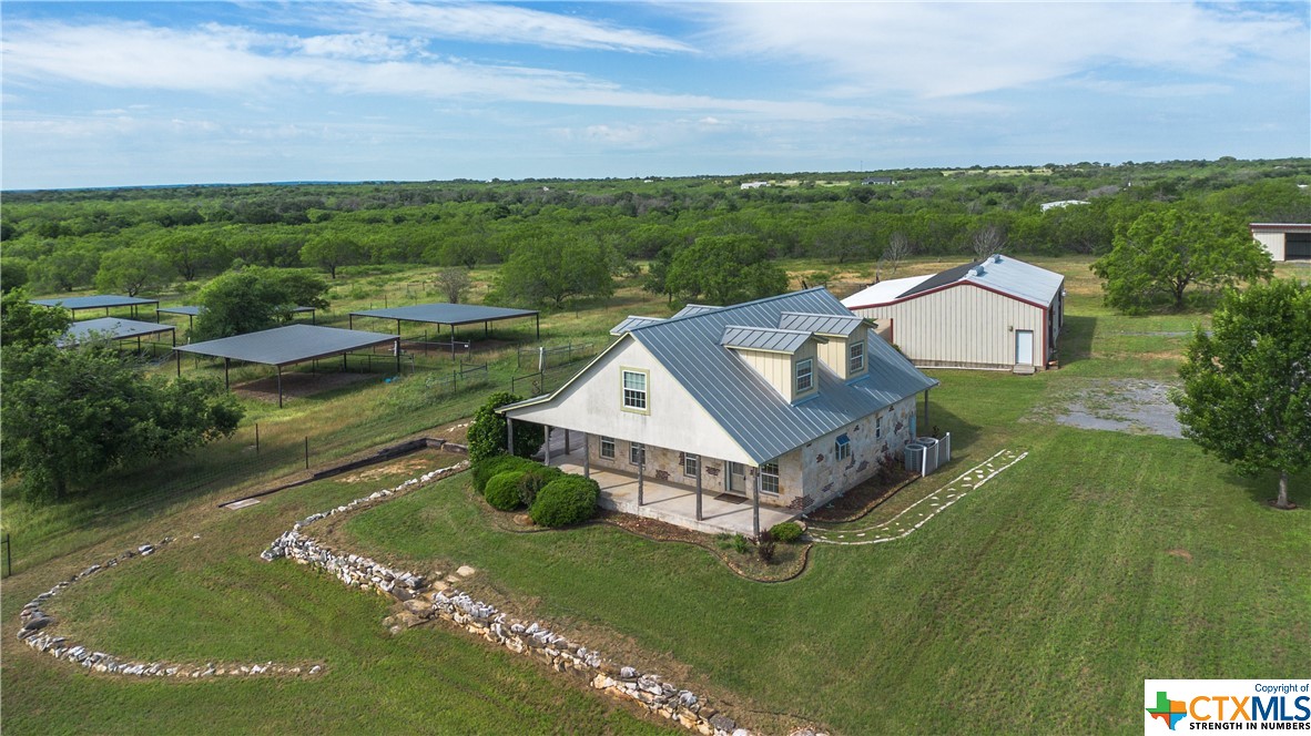 Come Home to this beautiful and unique 38 acre property that is ready for your animals, projects, hobbies or even a small business! Enjoy the private setting down your 1/4 mile driveway.  Sit on one of the many porches to enjoy your morning coffee or appreciate the stars and dark skies at night! The 2212 sq ft custom-built home features 12" thick Eco Block walls, metal roof, Double pane windows, Hickory cabinets, granite counters, new GE stainless double oven, Jen-Aire 5 burner down draft cooktop, stainless dishwasher and fridge, Australian Cypress and Bamboo hardwood flooring, instant hot water system, pocket doors throughout, ceiling fans, custom tile, GVEC Fiber Optic internet, 8KW solar panels. Step outside to the 30x60 Steel building with restroom! There is also a 24x80 Metal Machine Shed w/24x20 concrete pad, 4 bay closable doors. Open a small business in your 14x16 Cedar Cabin with AC. 6ft "Stay Tuff" fence surrounds home, out-builings 12 pens and 3 outlying pastures.  See attached list of amenities for more details on the vast features that this property offers!!