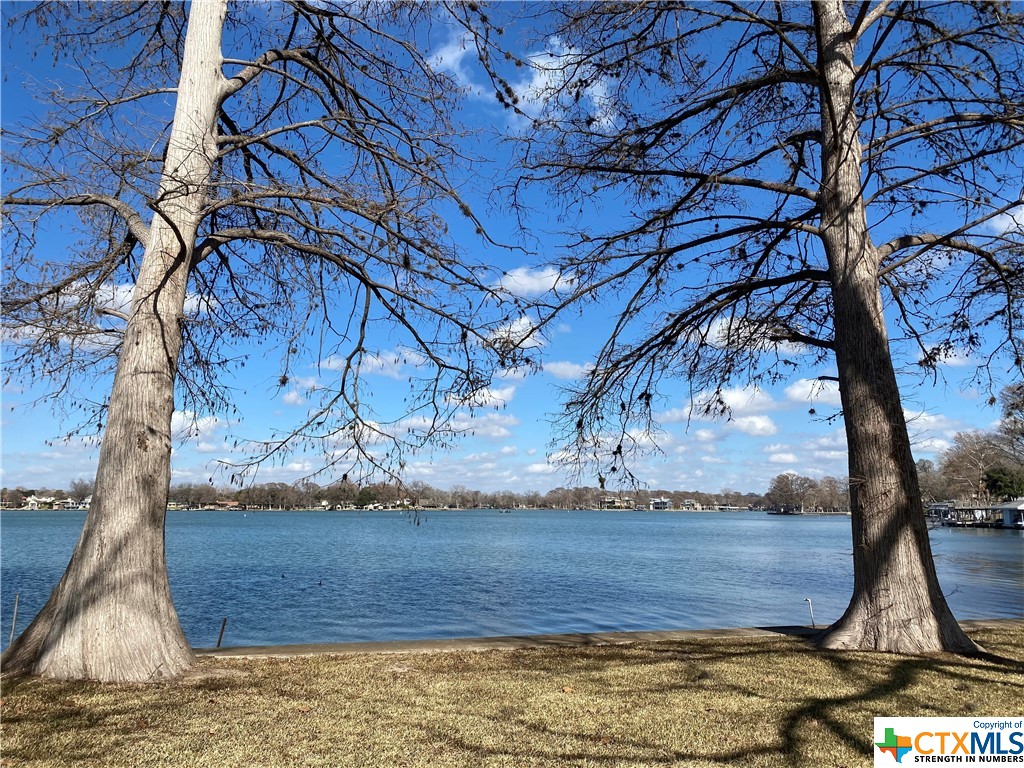Lake McQueeney waterfront Lot with an amazing view. 75 feet of waterfront. No Restrictions. Property is fenced on a corner lot right after the Marina.