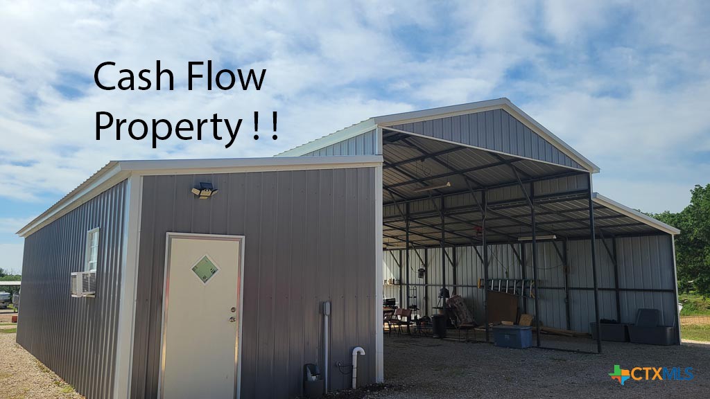 Income Producing Boat, RV Storage and rentals situated on 4.53 acres of desirable commercial property located on Hwy 86 just outside of the city limits of LulingTx approx 1/4 mile off 183 South. Luling is conveniently located 45 min. E. of San Antonio, 45 min. S. of Austin and 25 min. E. of San Marcos. Property currently has a Large 40’x 200’ covered parking structure that can house 16 rv’s. Also on site is a graveled area that can store up to 15 uncovered units. There is plenty of room for expansion to store another 30 to 40 RV's or build storage units . Besides the covered rv parking structure there is also 3 full hook up RV sites. 2 are uncovered and 1 is covered. The 1 full hook up site is located under the 2021 40’ x 44’ barn.  Built onto this barn is a 12’x15’ shop (or could be rented as storage) a 12’x25’ laundry/storage (that could also be rented) and opposite of RV space is a 12’ x 40’ covered area for equipment. Also on property is a 2006 3 bdr/ 2 bth manufactured home that is currently rented. Besides the mfgrd home, there is also a 2020 16’x 50’ building, completely finished out and is used by the owners as an office, storage and living quarters.  
Property was wired for an additional RV site to be added.  There is currently (1) vacancy in the "covered parking area", and (1) vacancy RV Full Hook-up space at the Barn.
Send your request for the Rent Roll and Financials for a 7.5% Cap Rate