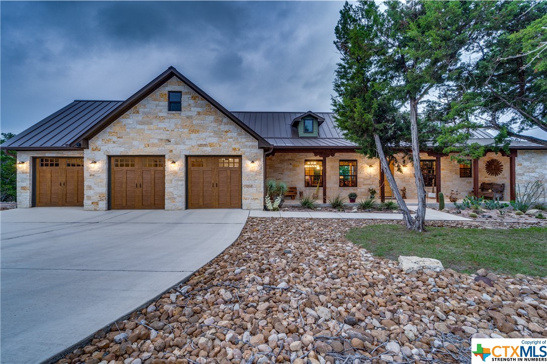Experience the quintessential Texas lifestyle at 132 Patriotic Way, Fischer, Texas! Perched amidst the rolling hills of the Hill Country, this custom-designed sanctuary offers unparalleled views that stretch for miles. Every detail of the meticulously crafted floor plan exudes luxury, showcasing top-of-the-line finishes that elevate the living experience. From the gourmet kitchen adorned with high-end appliances to the thoughtfully appointed living spaces, this exquisite retreat offers unparalleled comfort and style.

Beyond its aesthetic appeal, practicality reigns supreme in this home. A spacious floored attic provides ample storage space, ensuring clutter-free living. Moreover, the property is ADA compliant, offering accessibility features that cater to all. Whether you're savoring the panoramic vistas from the expansive patio or unwinding in the serene ambiance of the interior, 132 Patriotic Way embodies the essence of refined Hill Country living.