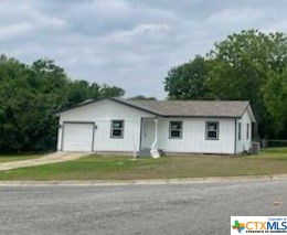 Attention! A home in Lampasas for under 200K! 3 Bedroom 2 Baths, One car garage. New siding & windows for starters. Beautiful hardwood floors! Corner lot with a huge fenced yard! Owner is currently finishing the remodel for this home's new owner. Many updates to come. Call for your appointment today!