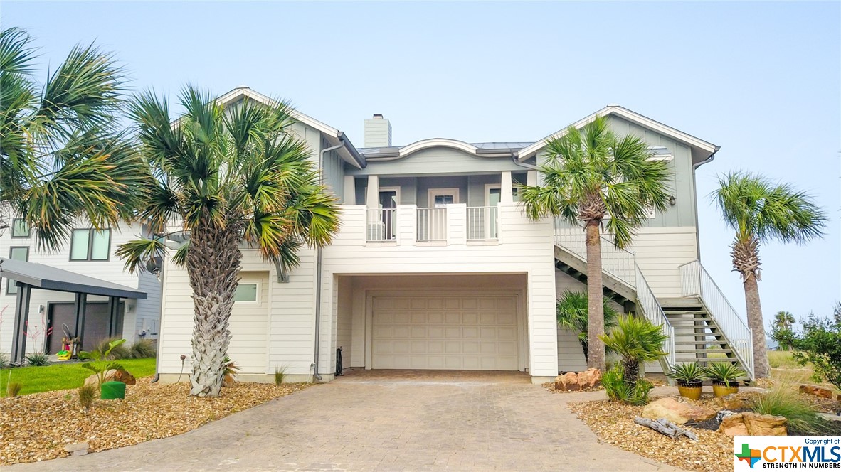Great opportunity to own a  waterfront home in a nice tranquil gated community. This home is located about 5 miles out of Seadrift and has some of the best fishing on the Texas coast. As you enter the main area on the second level, you, will find an open concept combining the living, dining, and kitchen providing great entertainment for all. On this level the primary bedroom, secondary bedroom, and  the laundry room are also located. It also has a covered upper porch great for grilling and enjoying amazing views of San Antonio Bay. The lower level has 2 additional bedrooms with ensuite baths and exterior entrances for additional privacy. In the back there is also a fire pit and a short walk to the covered fishing pier and boat dock. The garage is oversized to accommodate a 25' boat and has 2 great storage rooms for tackle and outdoor accessories. This is a great community, the present owners relocated to a new home at the end of the street. Schedule an appointment today to view and enjoy the approaching summer and start building family memories.