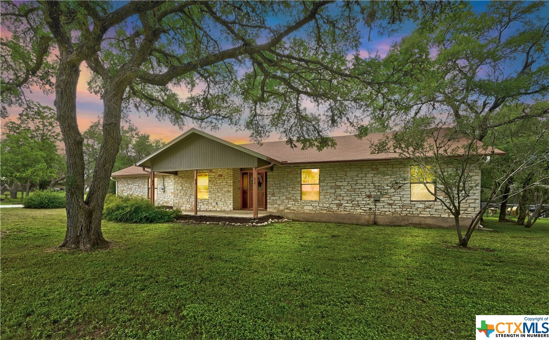 City convenience meets Hill Country charm! Tucked away in magical Manchaca, just 15 miles from downtown Austin is 1004 Swallow Drive.  The house is nestled in the middle of a lot that is over a half acre, with no HOA. This beautiful hill country, ranch style home features and inviting open floor plan. The recently updated include new countertops, vinyl plank flooring throughout and an interior & exterior paint job making this residence turn key. Walk through the front door and immediately fall in love with the bright, airy and incredibly spacious living area featuring vaulted ceilings, an original stone, wood burning fireplace, built in shelving, eat in kitchen, stainless steel appliances and tons of natural light. The primary bedroom is generously sized and includes an ensuite bathroom with a walk-in closet, double vanity and garden tub. Two additional bedrooms are located on the opposite end of the home and share a full bathroom. Step outside and discover a peaceful oasis perfect for outdoor gatherings, gardening, playing catch or simply listening to native birds. **House has been virtually staged**