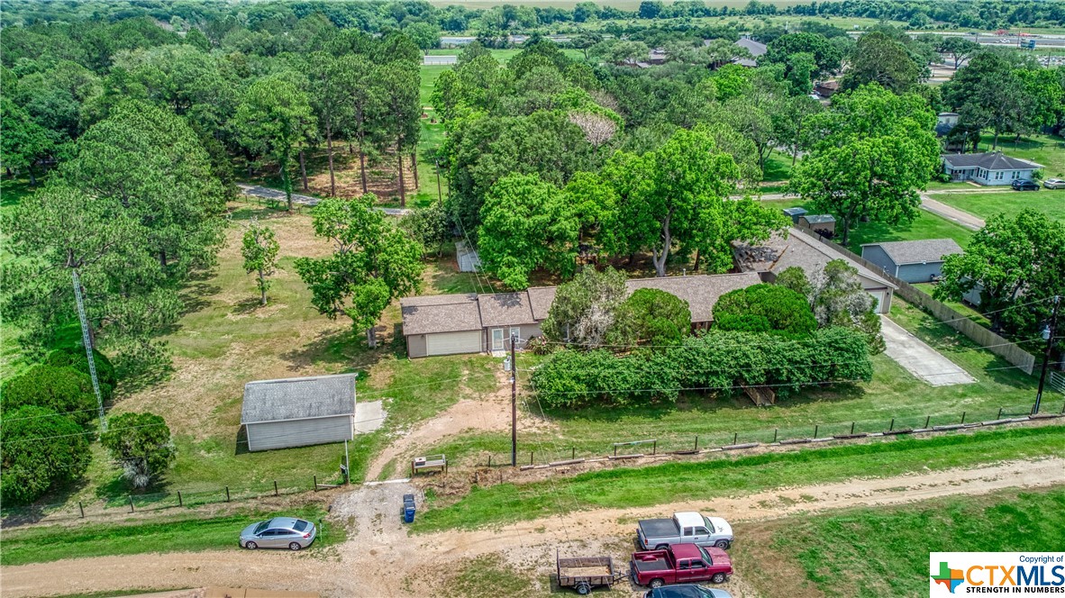 No showings until Friday, May 10th starting at 2PM. 1.347 acres. 2 homes. Main house 2 beds, 2 baths, game room, 2-car attached garage. Guest house (2020) 1 bed, 2 baths, attached garage, concealed room. 2 storage sheds and oversized detached garage. 50-foot private tower. Roof replaced 2021, new HVAC in 2020, recently serviced. Never flooded. Surge protector 2022 breaker box. Main house updates in 2020, including Pex A piping and new gas lines inside the home. In 2018, main house foundation raised 16" off the ground for crawl space access. Main on pier and beam. Main has lifetime transferable foundation warranty. Main house renovated with new wiring, insulation, sheetrock, light fixtures, plumbing fixtures, flooring, tile, paint, cabinets, doors, double-pane windows, Larson security storm doors, a Travertine tiled master bath, and new James Hardie HardiPlank siding. Radiant barrier installed in attic in 2019. Main sewer was replaced in 2019. Separate electric meters, electric pole, and water meters. Concealed room has AC and a return.