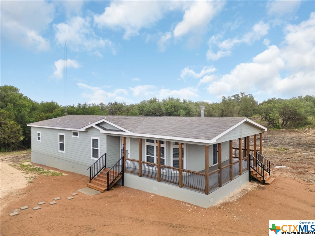 THIS IS A MUST SEE! The 2019 model mobile home boasts three bedrooms, two bathrooms, and a fireplace. It includes a spacious master bathroom with a large soaking tub and an elegant walk-in shower. Positioned on more than six partially wooded acres, the property offers outstanding views.