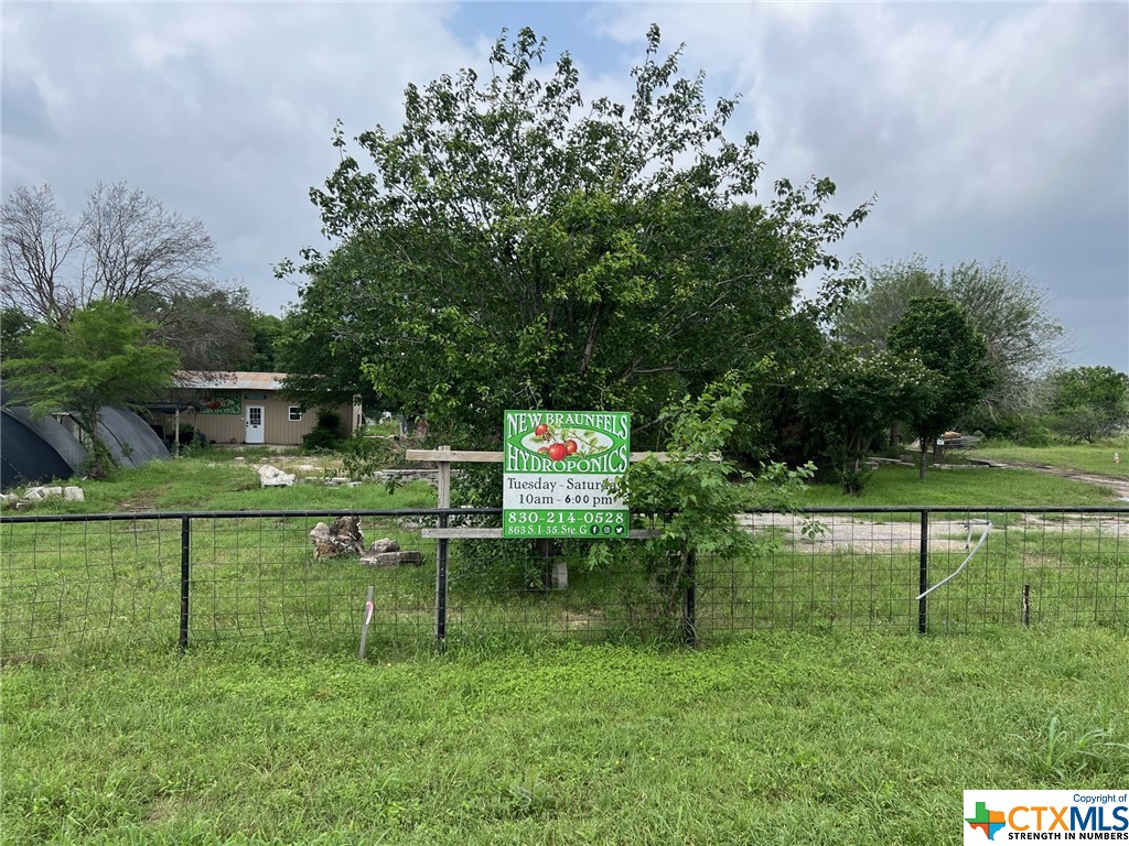 Attention Entrepreneurs! Huge Opportunity with this Multi-Use property in a Prime Location just North of New Braunfels, less than 1/4 mile off IH-35. This level 2 acre tract has been used as a Hydro-Ponic Nursery among other commercial uses. There are several usable/livable structures along with two Greenhouses totaling over 3000sqft of growing space.