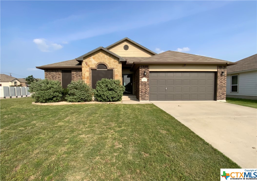 Beautiful home on a corner lot with 3 bedrooms, 2 baths, 2 car garage, and fenced in backyard!  Ceramic tile through out the home. This well maintain home has solar screens and gutters. Perfect starter home!