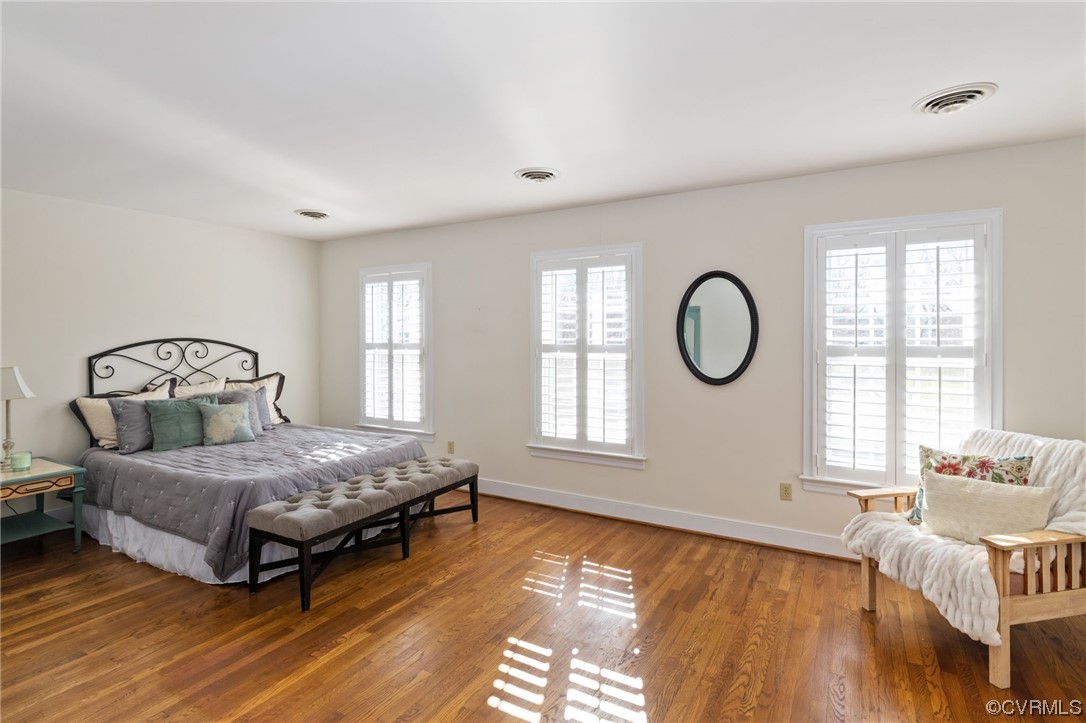 The Primary Bedroom features hardwood floors a walk-in closet and a sweater closet!