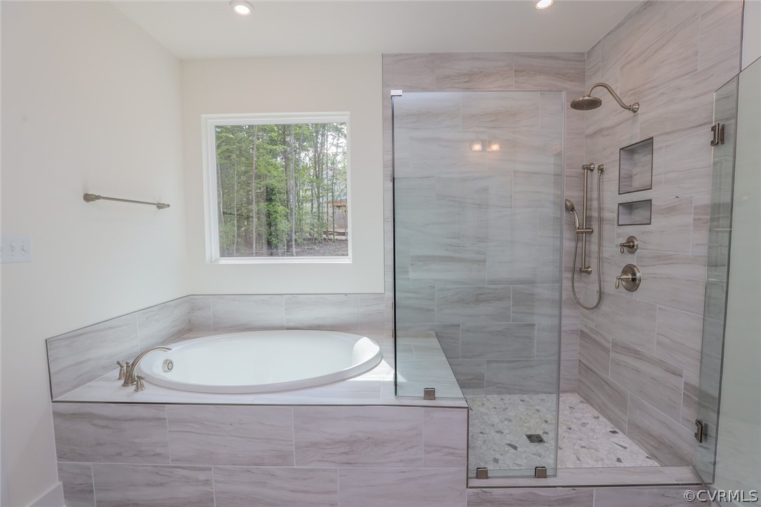 Photo represents the plan, not the actual home. Design selections may vary. Primary suite w/ luxury primary shower, separate vanities and window package.